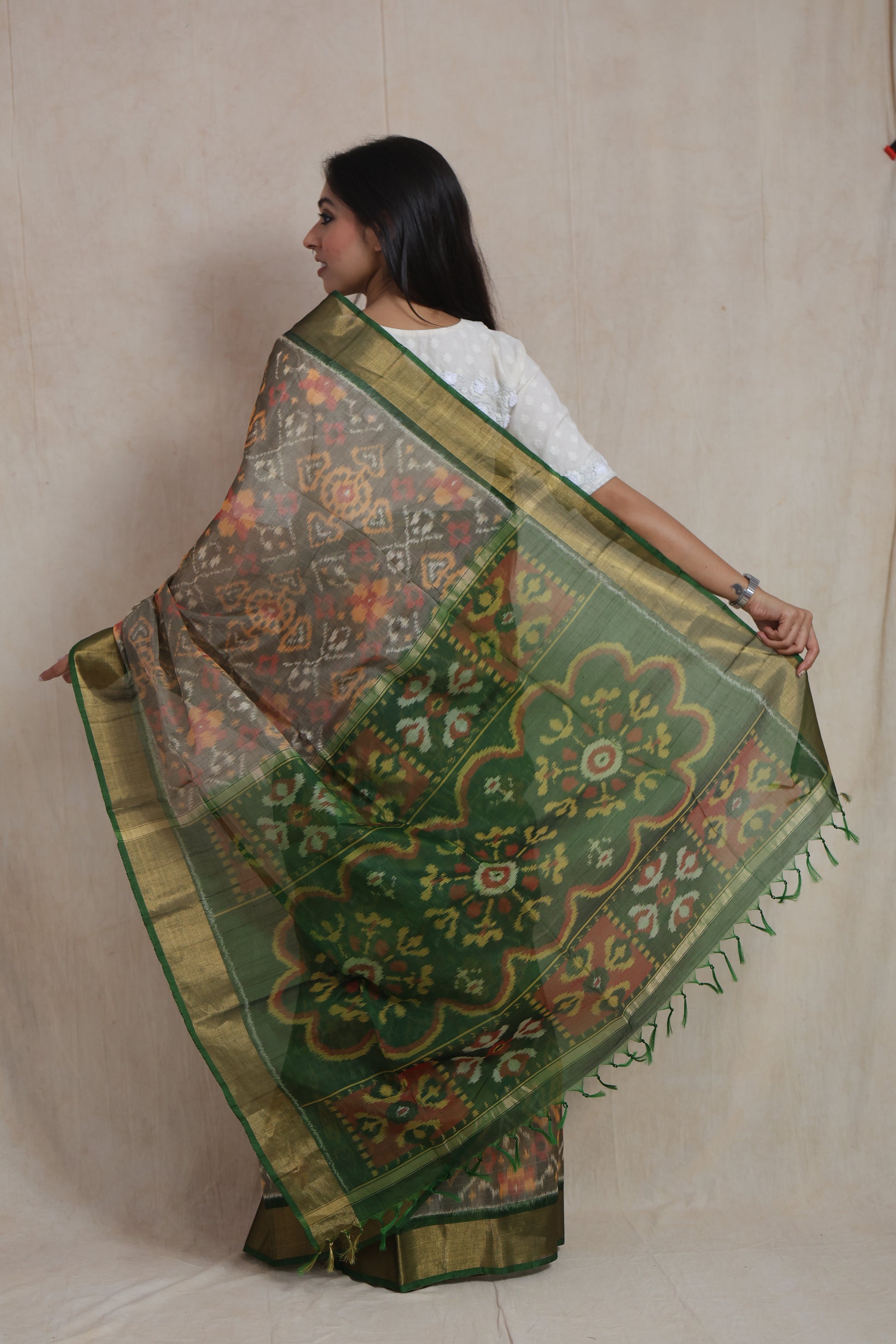 Back view of Panchampali handloom silk cotton saree showcasing emerald green floral pallu with traditional woven design