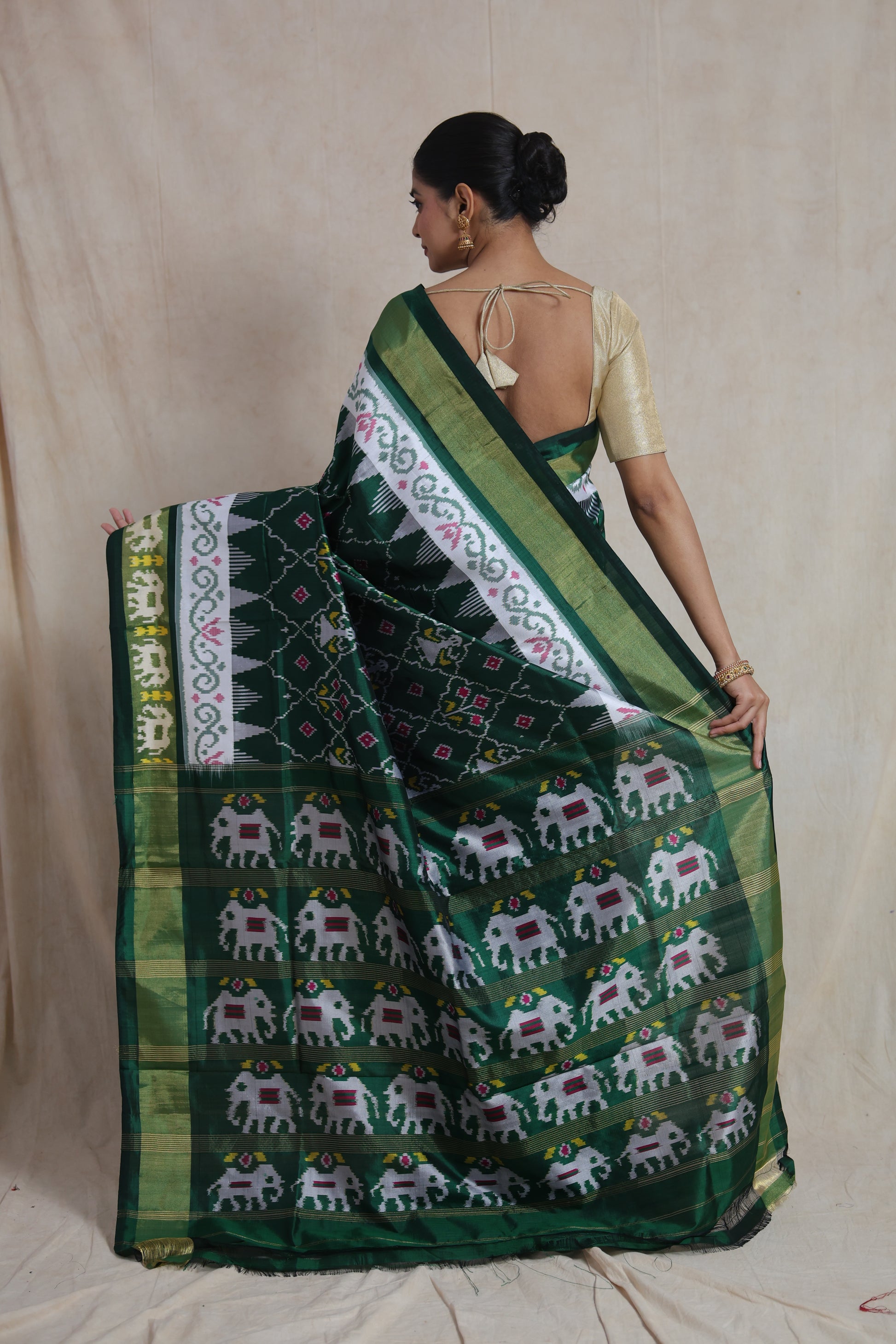 Back view of emerald green Panchampali Silk saree with elephant motifs and ikat weave