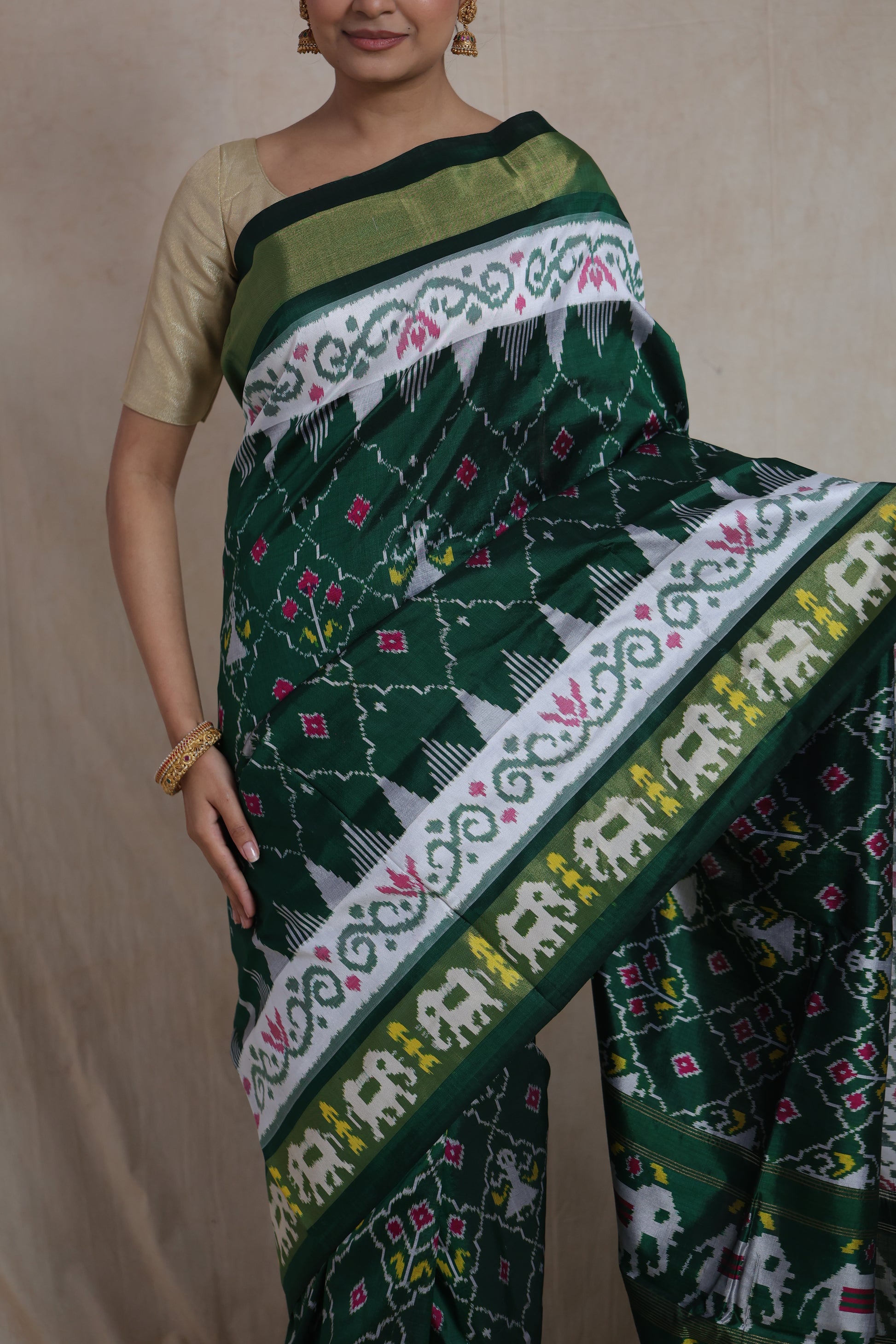 Close-up view of emerald green Panchampali Silk saree with elephant border detailing