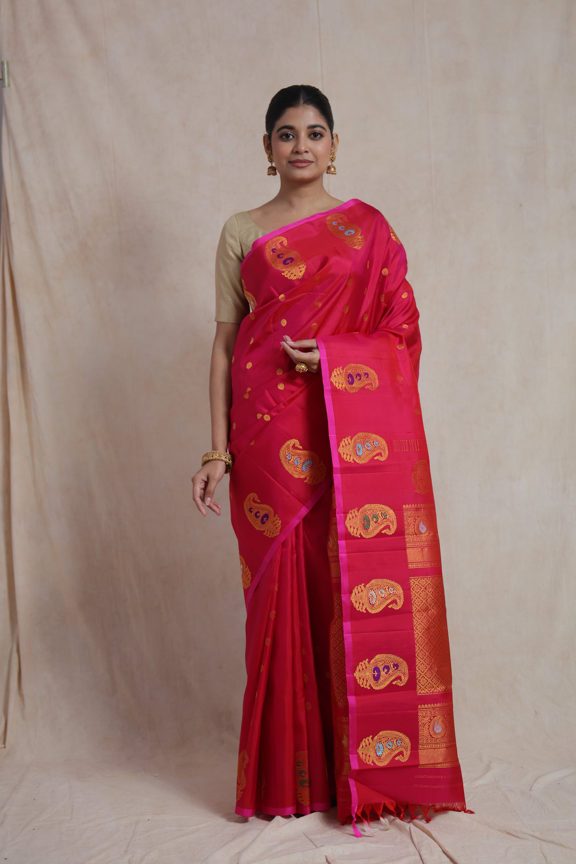 Portrait view of luxurious rani pink Gadwal silk saree