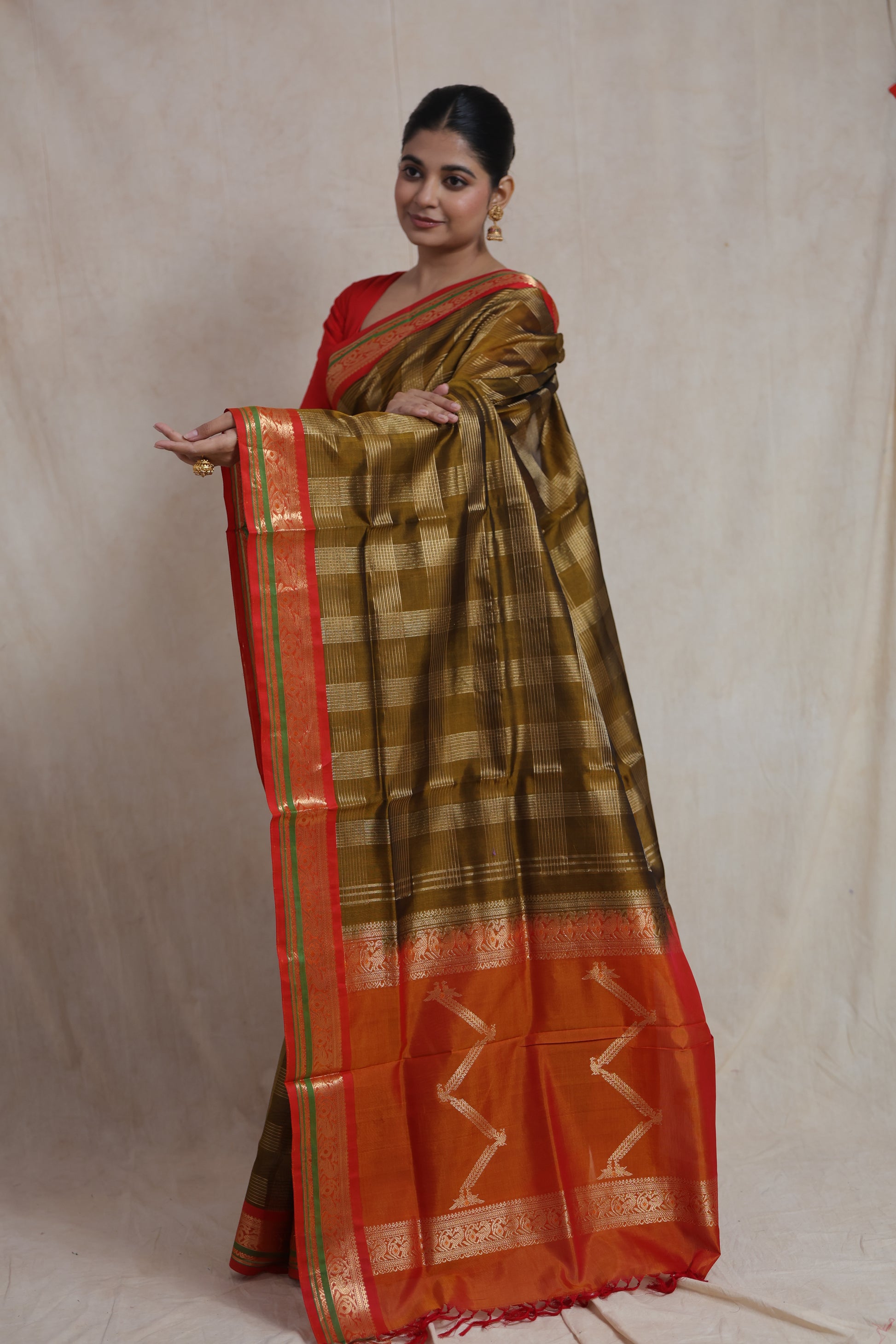 Festive olive gold Kanchipuram silk cotton saree with zari border