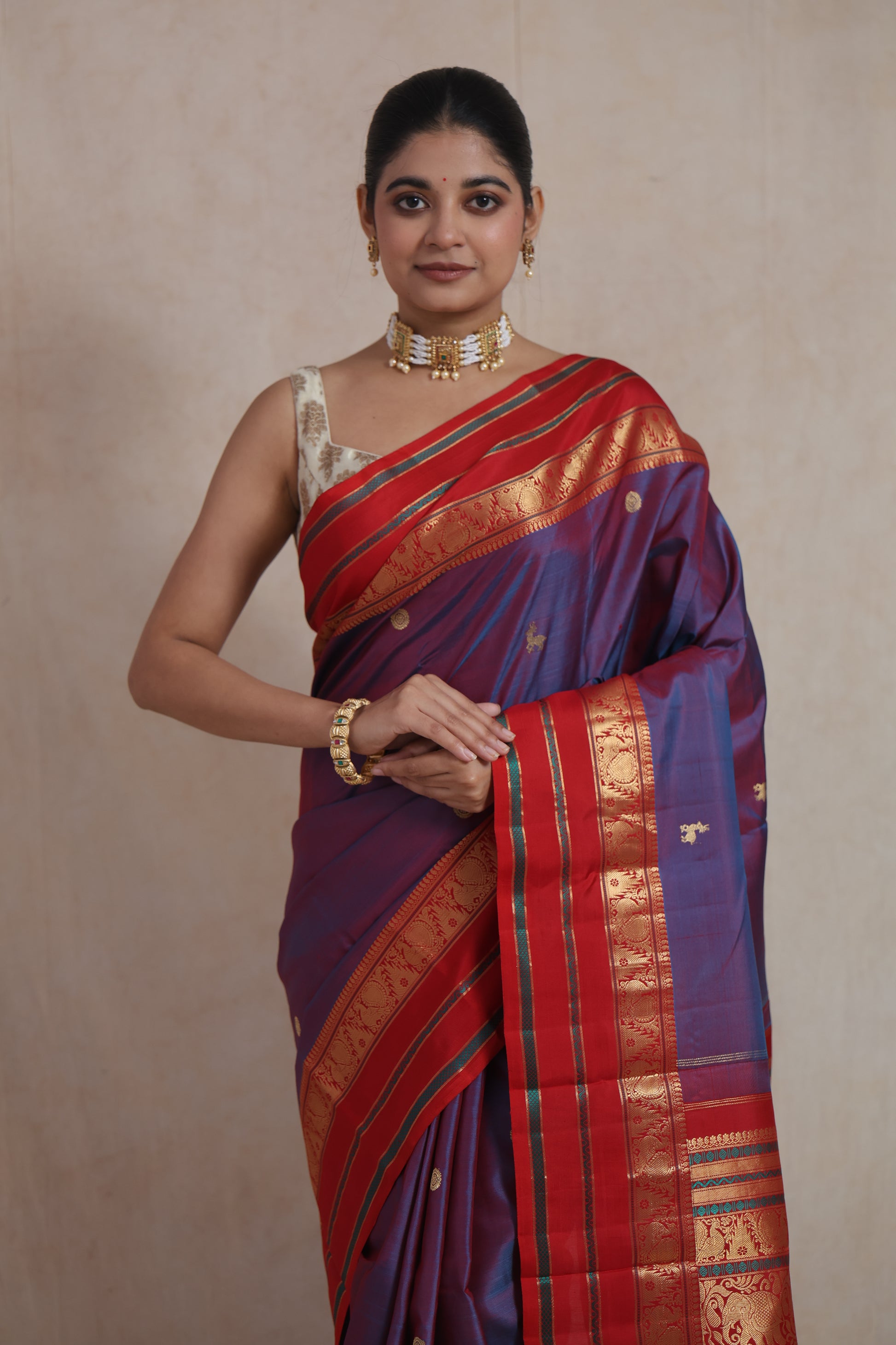 Front pose of royal violet Kanjivaram silk saree with traditional zari work