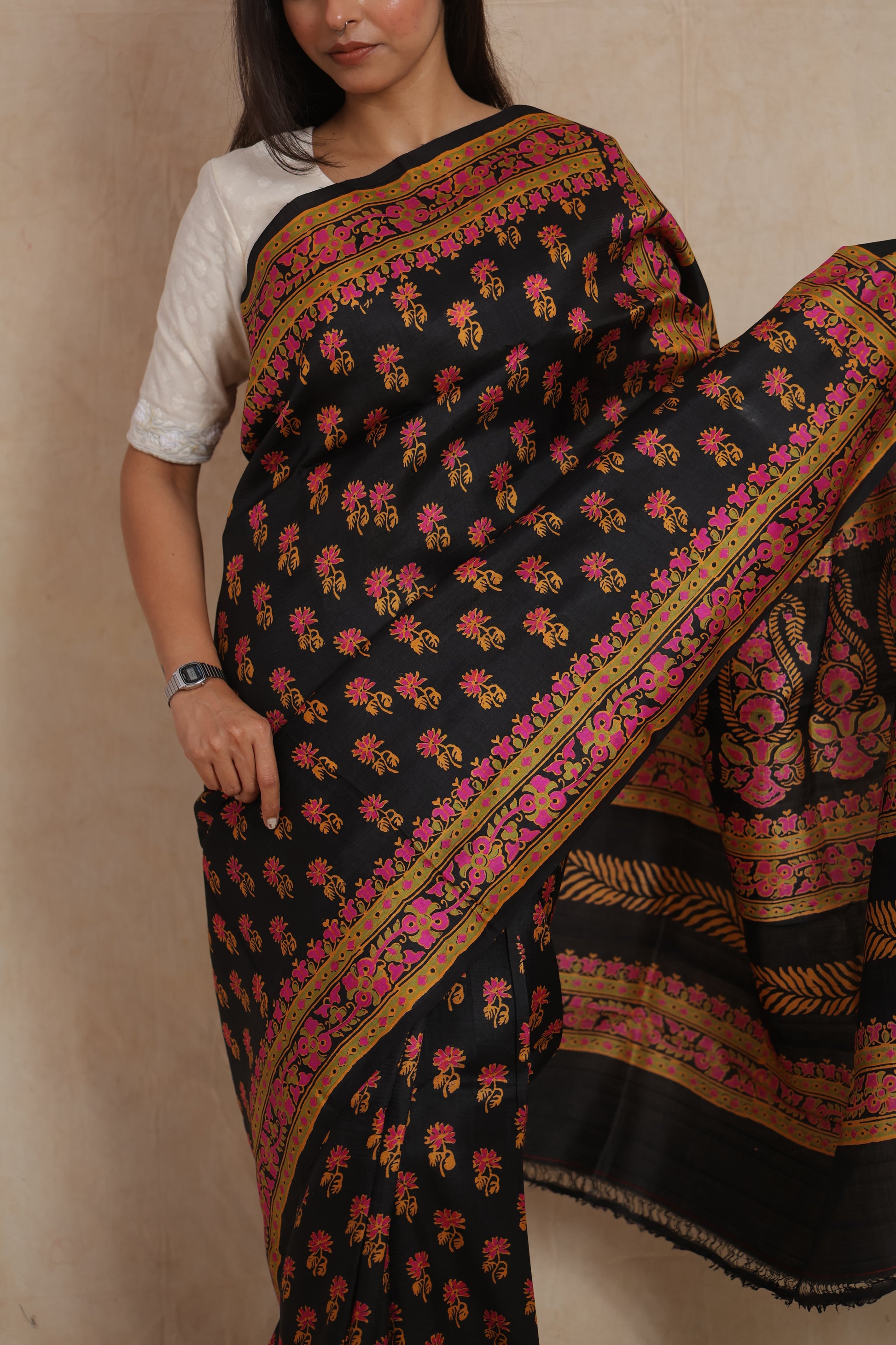 Black Batik silk saree featuring floral buttas and decorative border detailing