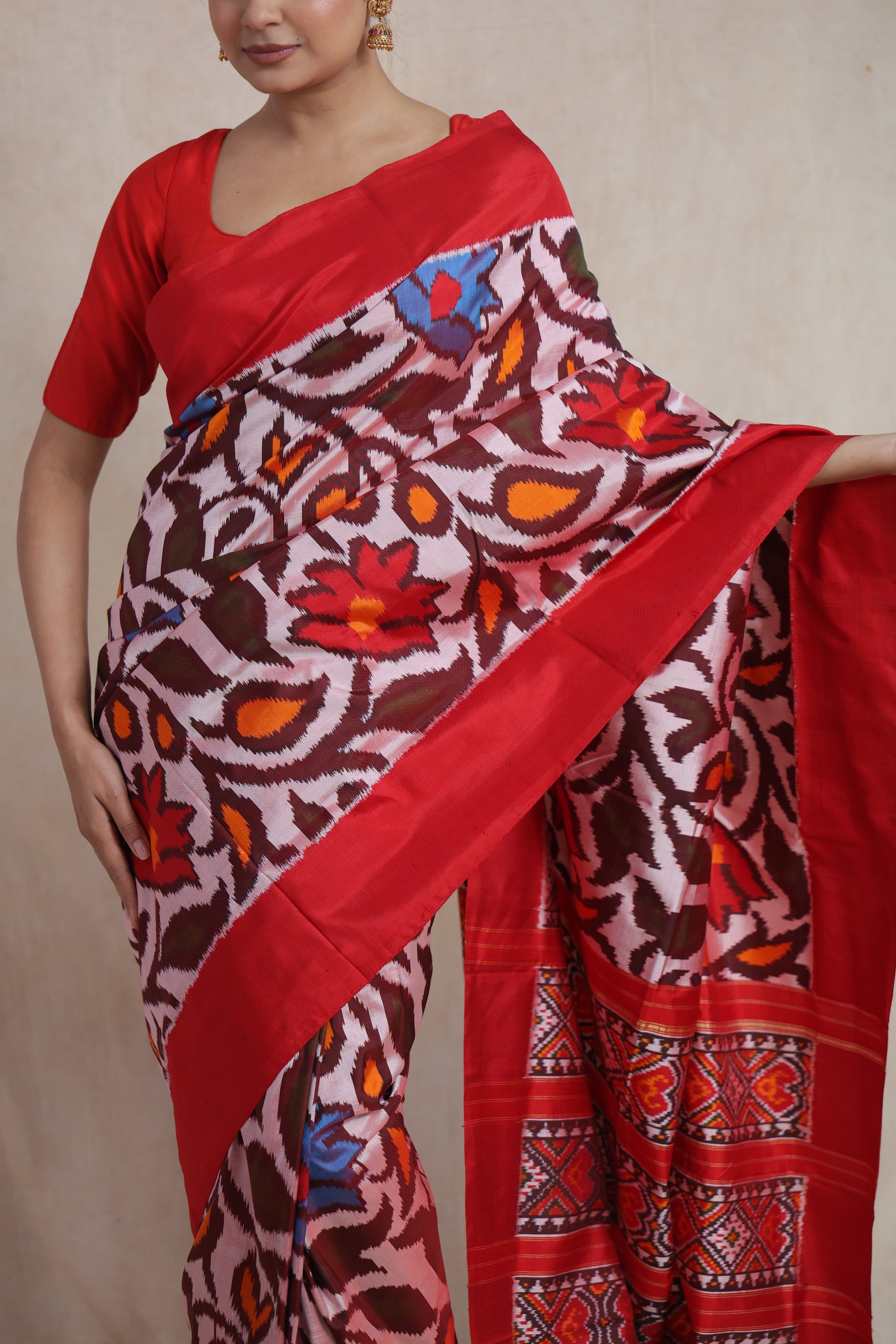 Close-up of Panchampali handloom silk saree with vibrant floral ikat patterns and red border