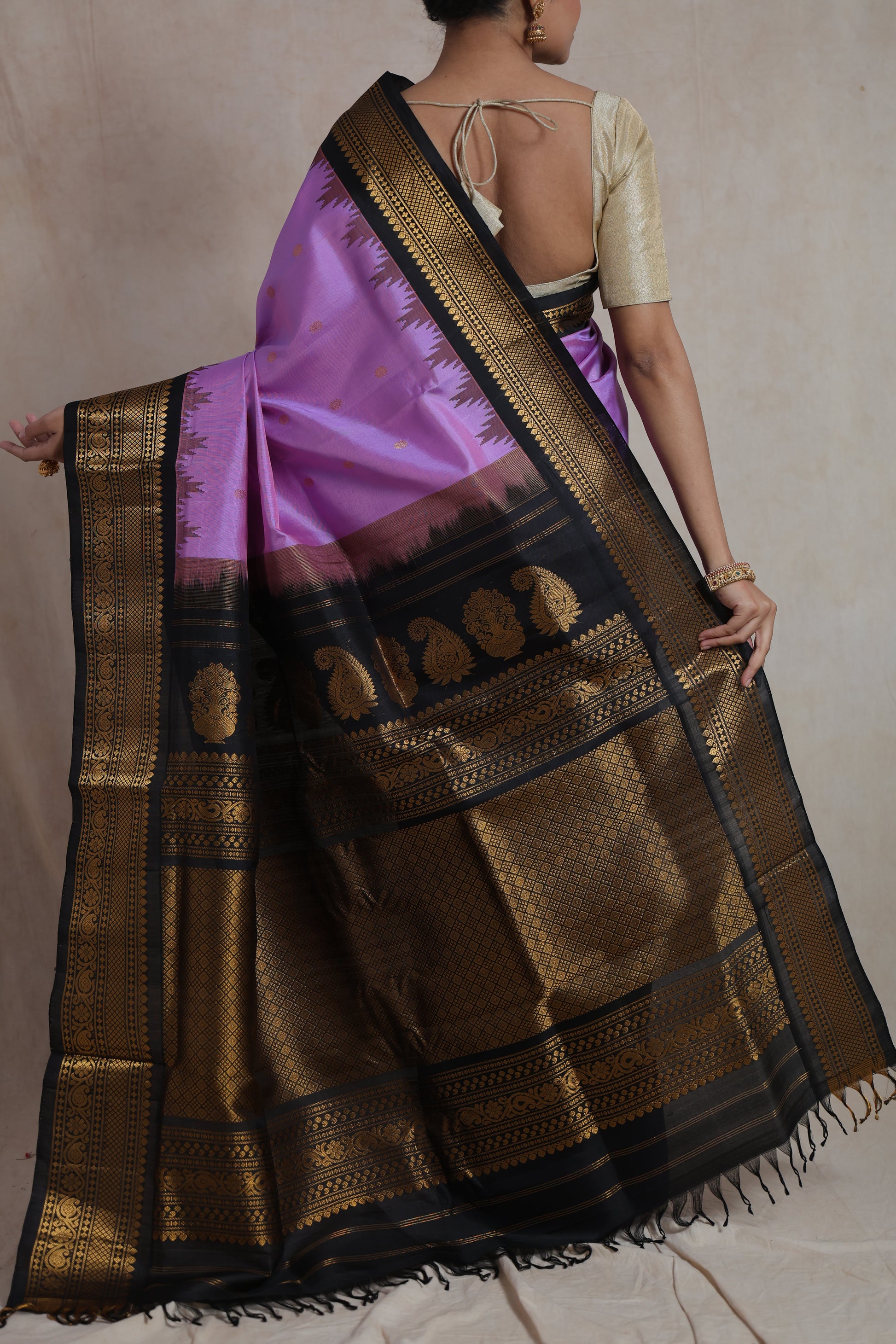 Back view of lavender purple Gadwal silk saree showcasing ornate pallu design