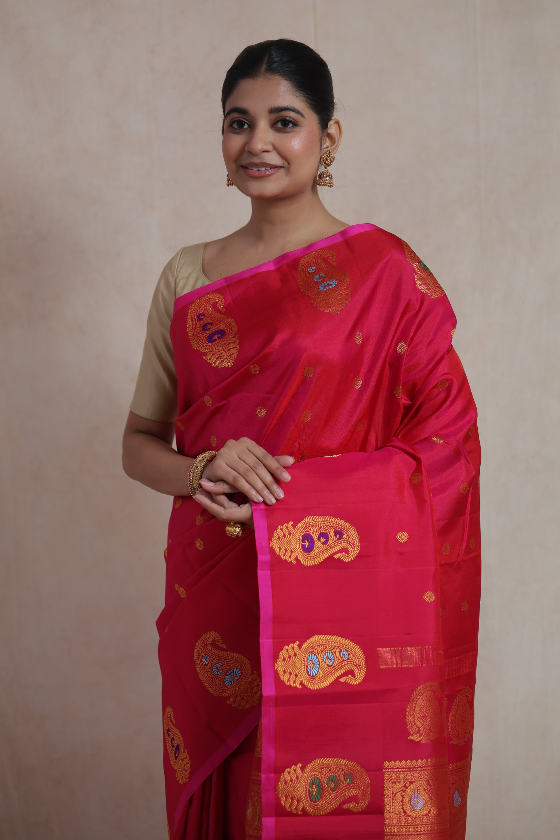 Portrait view of luxurious rani pink Gadwal silk saree