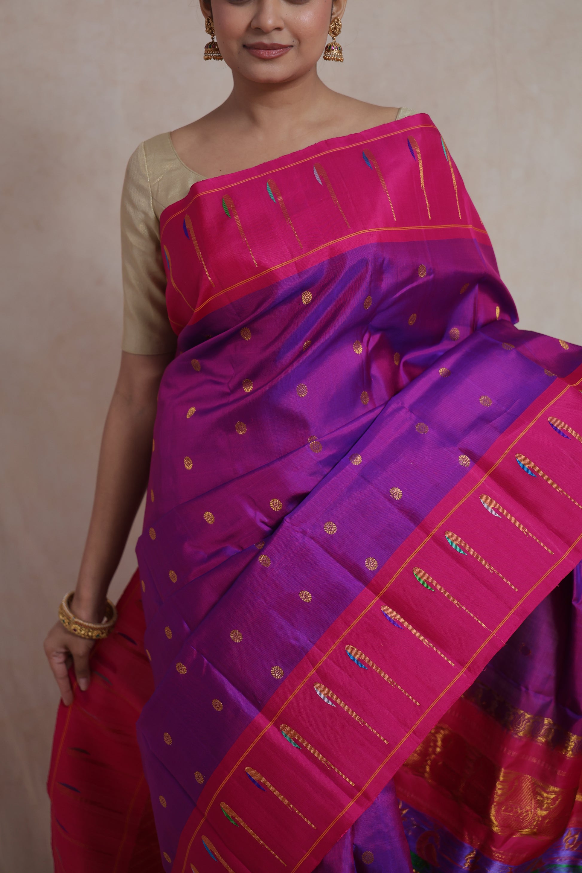 Elegant pose in royal purple Gadwal silk saree with pink zari border