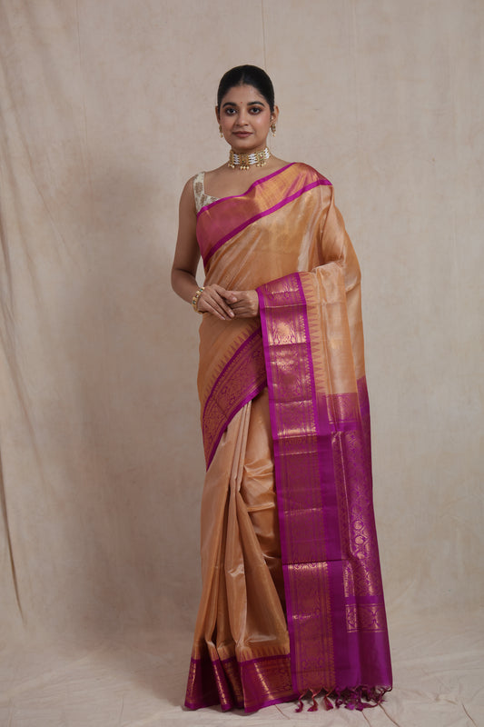 Full view of golden beige Kanchipuram Sico saree with magenta zari woven border