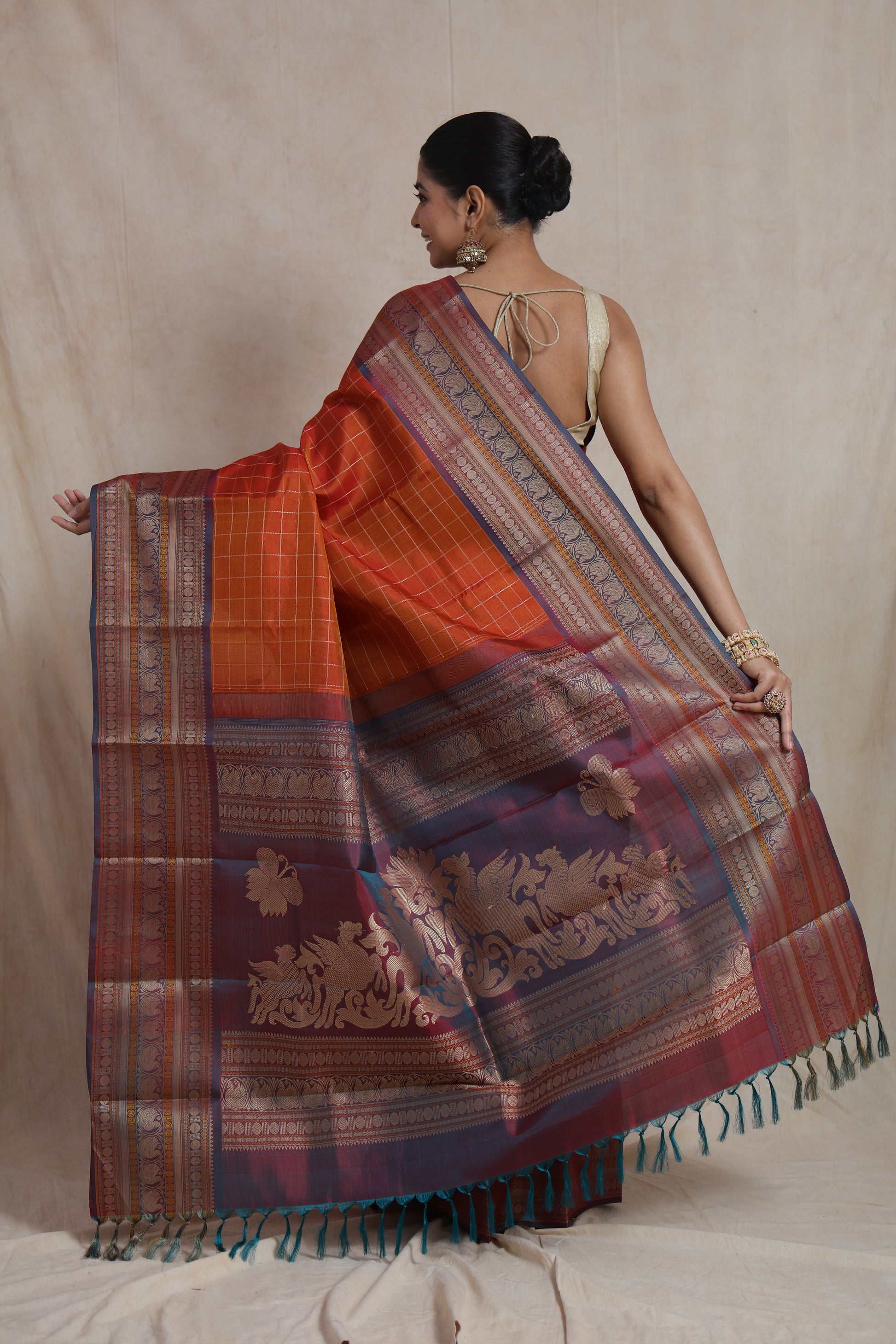 Back view of Kanjivaram silk saree featuring elaborate zari woven pallu
