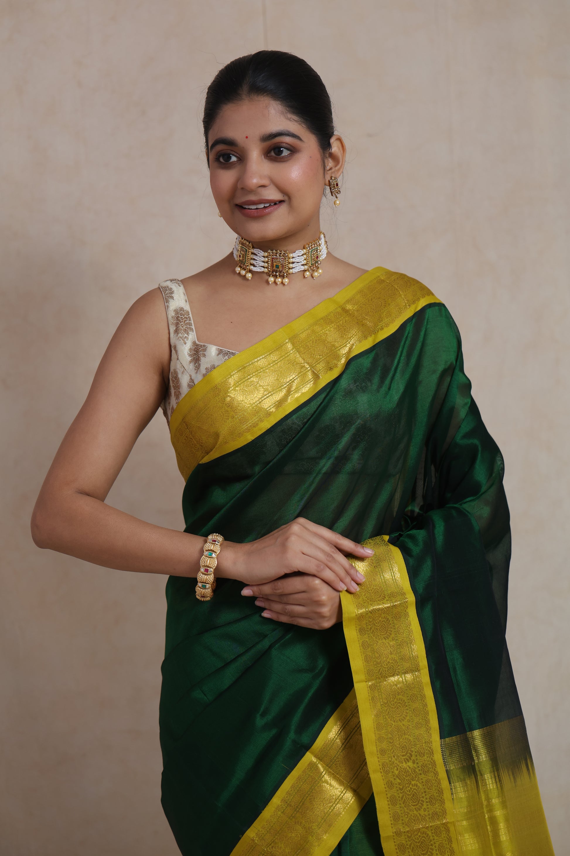 Close-up drape of emerald green Kanchipuram silk cotton saree