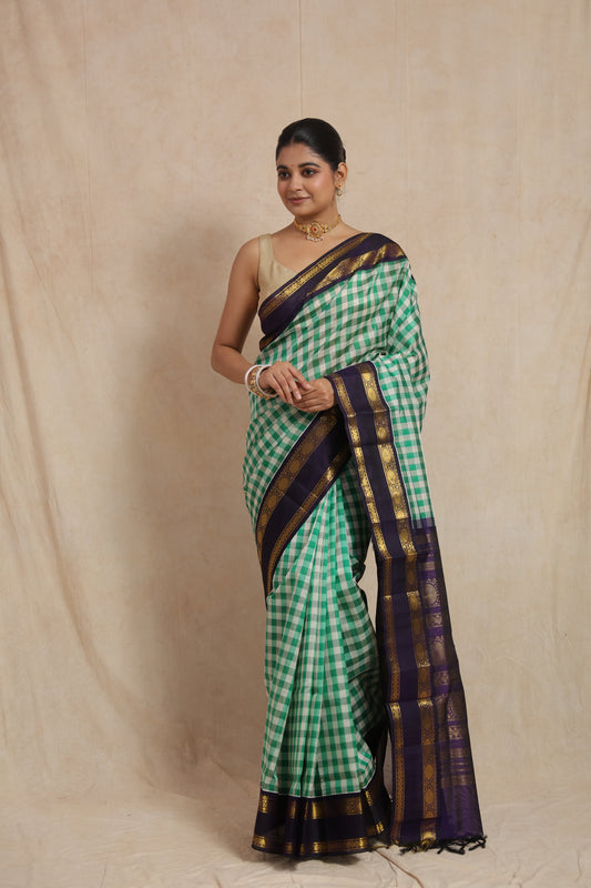 Full view of green checked Kanchipuram Sico saree with elegant purple border