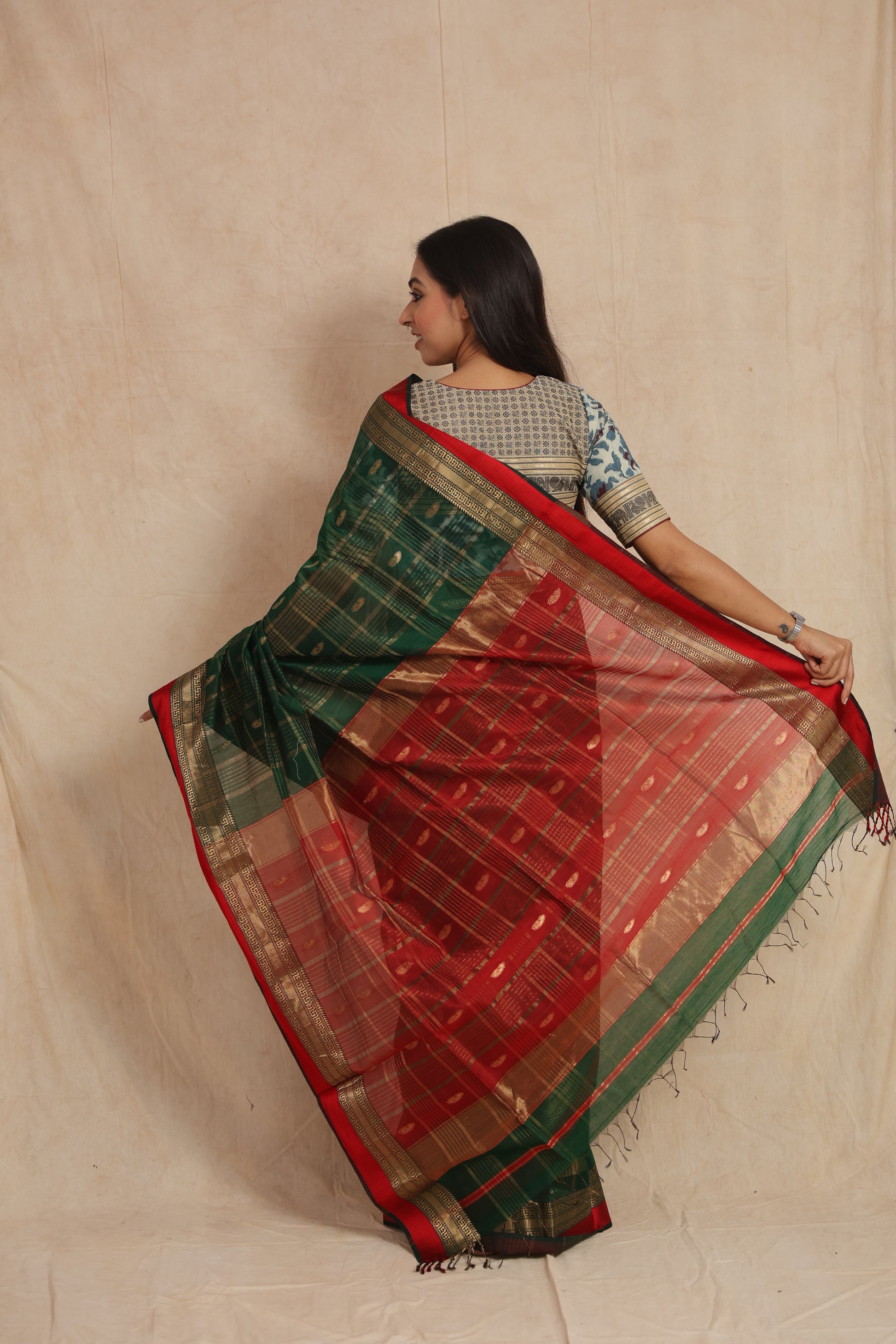 Back view of green Maheshwari cotton saree with red woven pallu