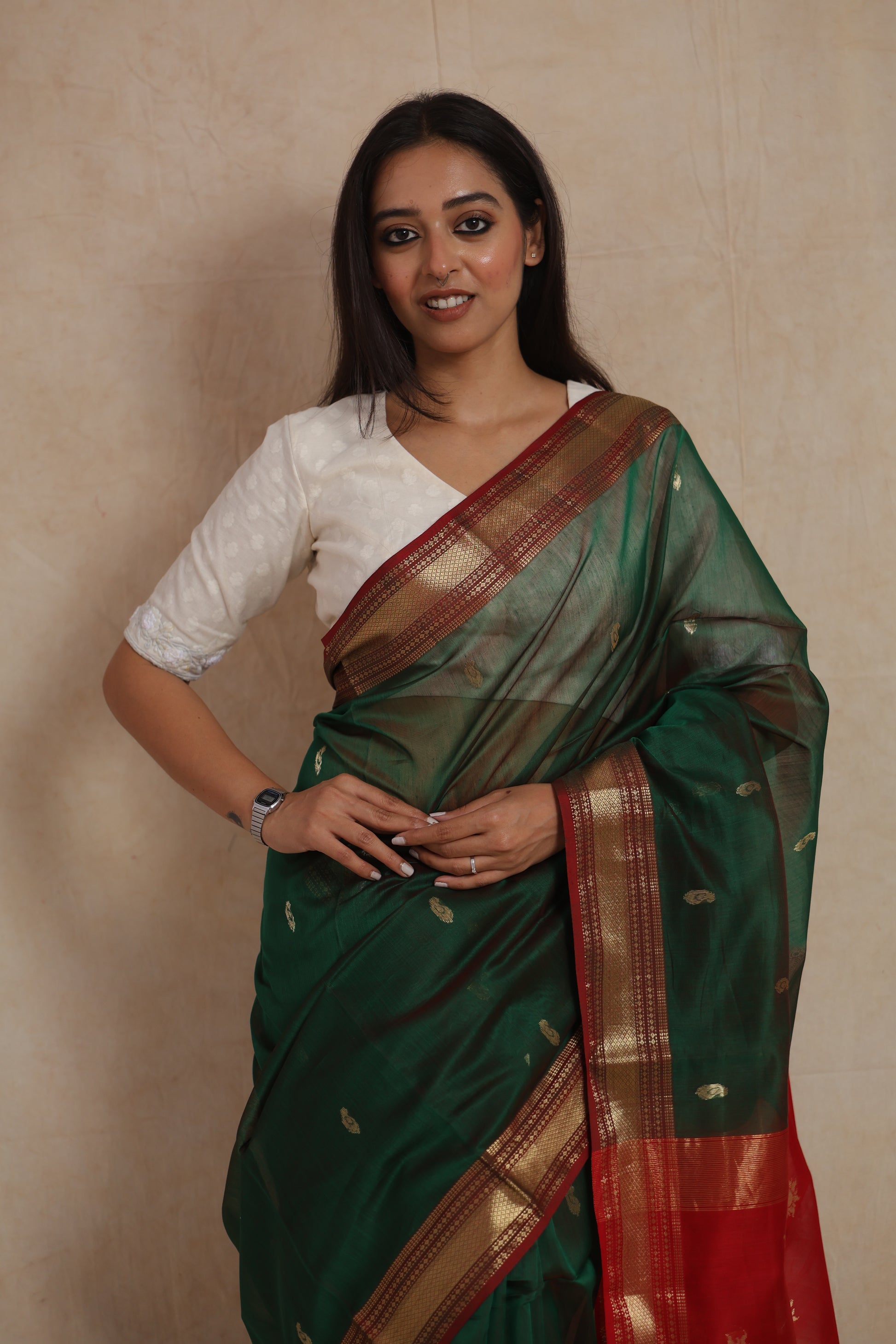 Detailed drape view of bottle green Maheshwari handloom silk cotton saree with elegant red pallu