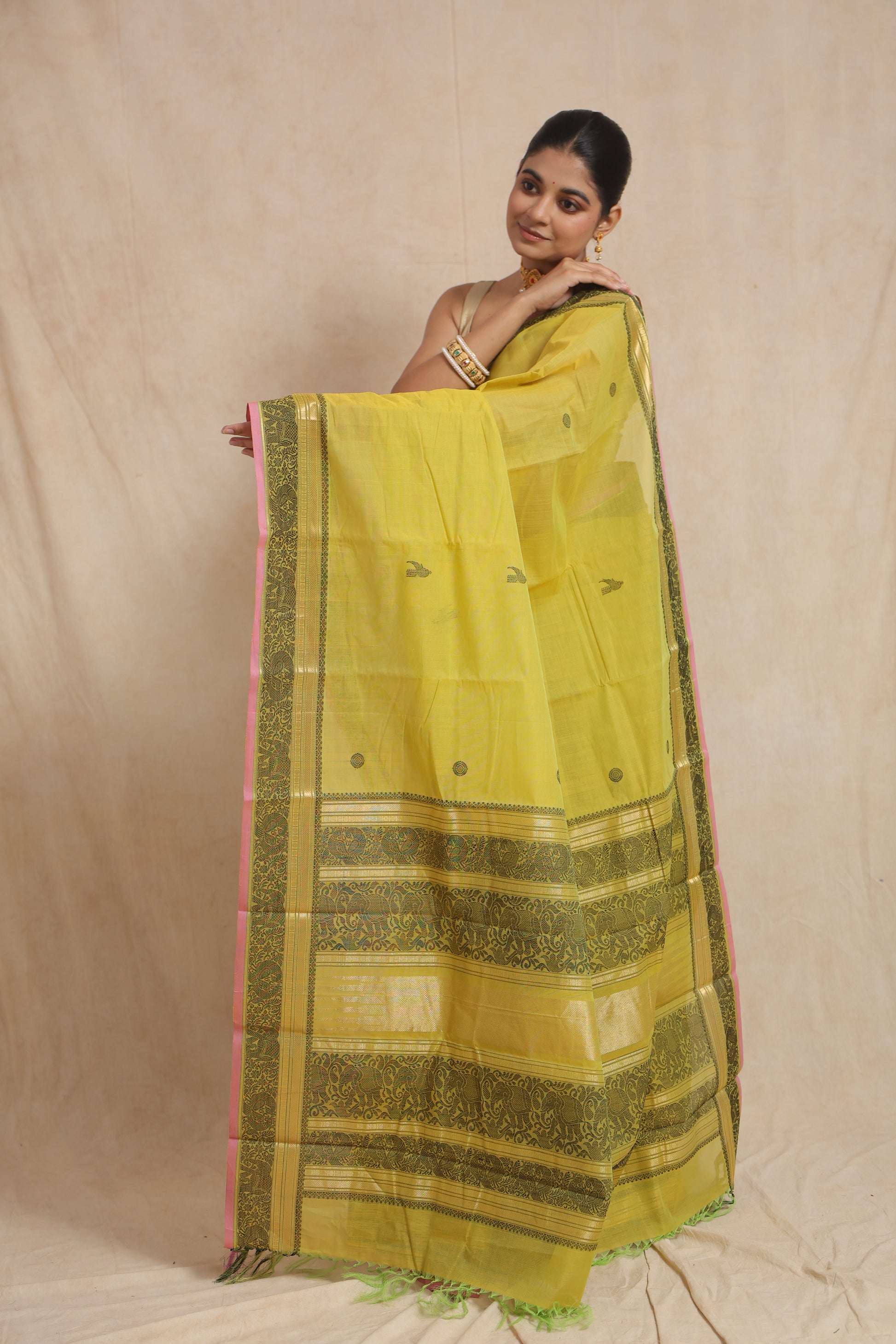 Classic portrait view of greenish yellow Kanchipuram cotton saree