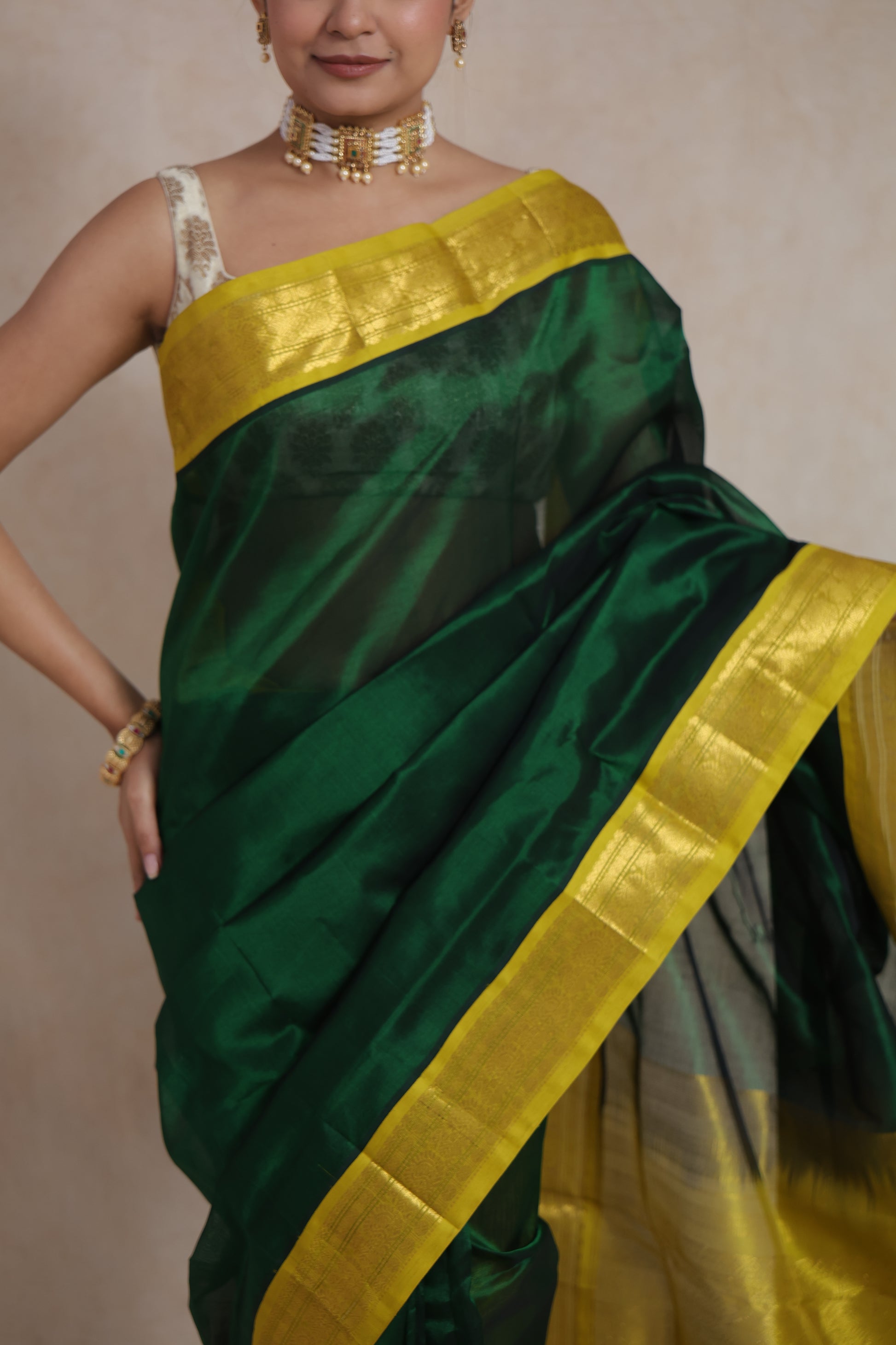 Back view of green Kanchipuram silk cotton saree with zari pallu