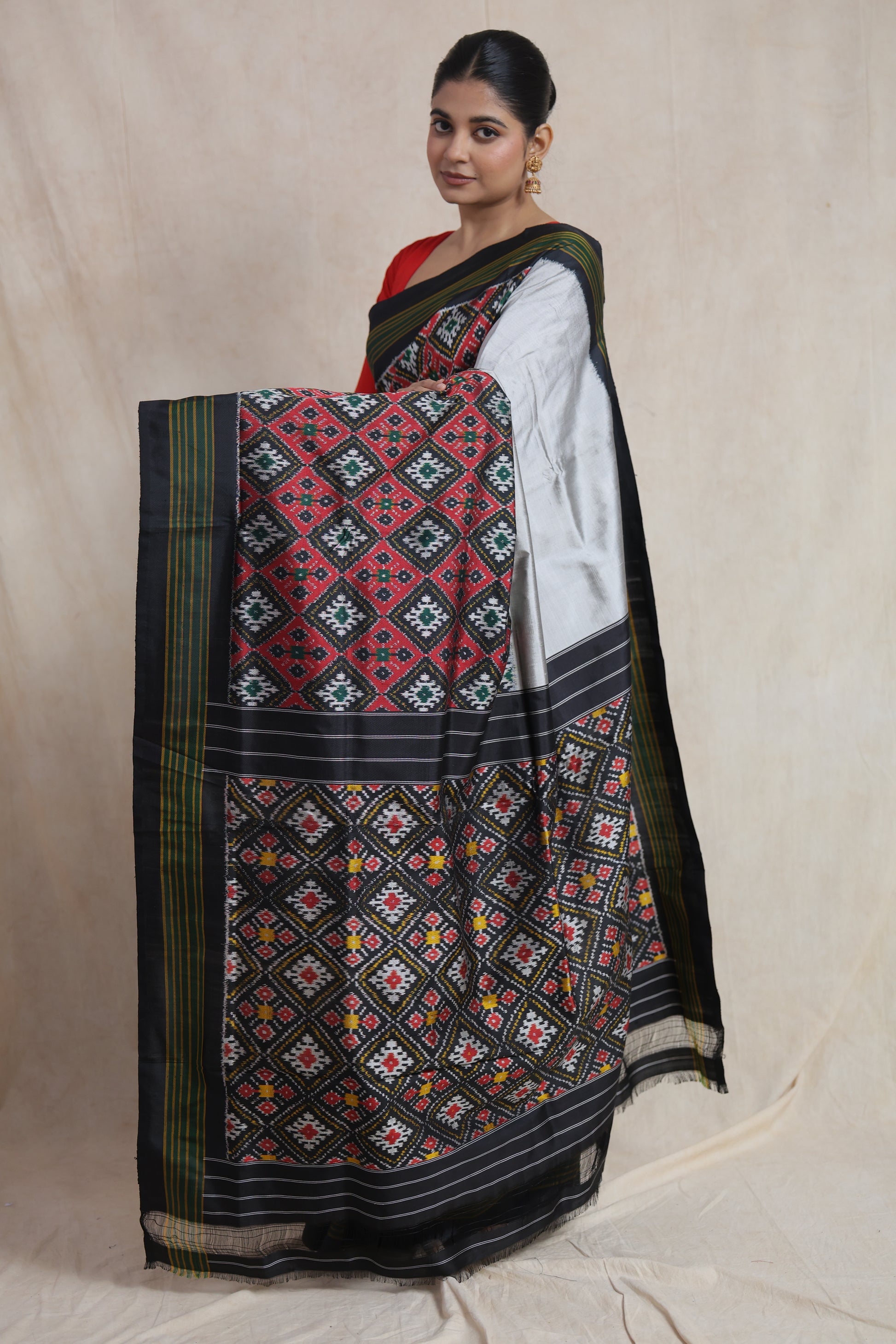 Handcrafted Panchampali handloom silk saree with classic black base, silver accents, and heritage ikat motifs
