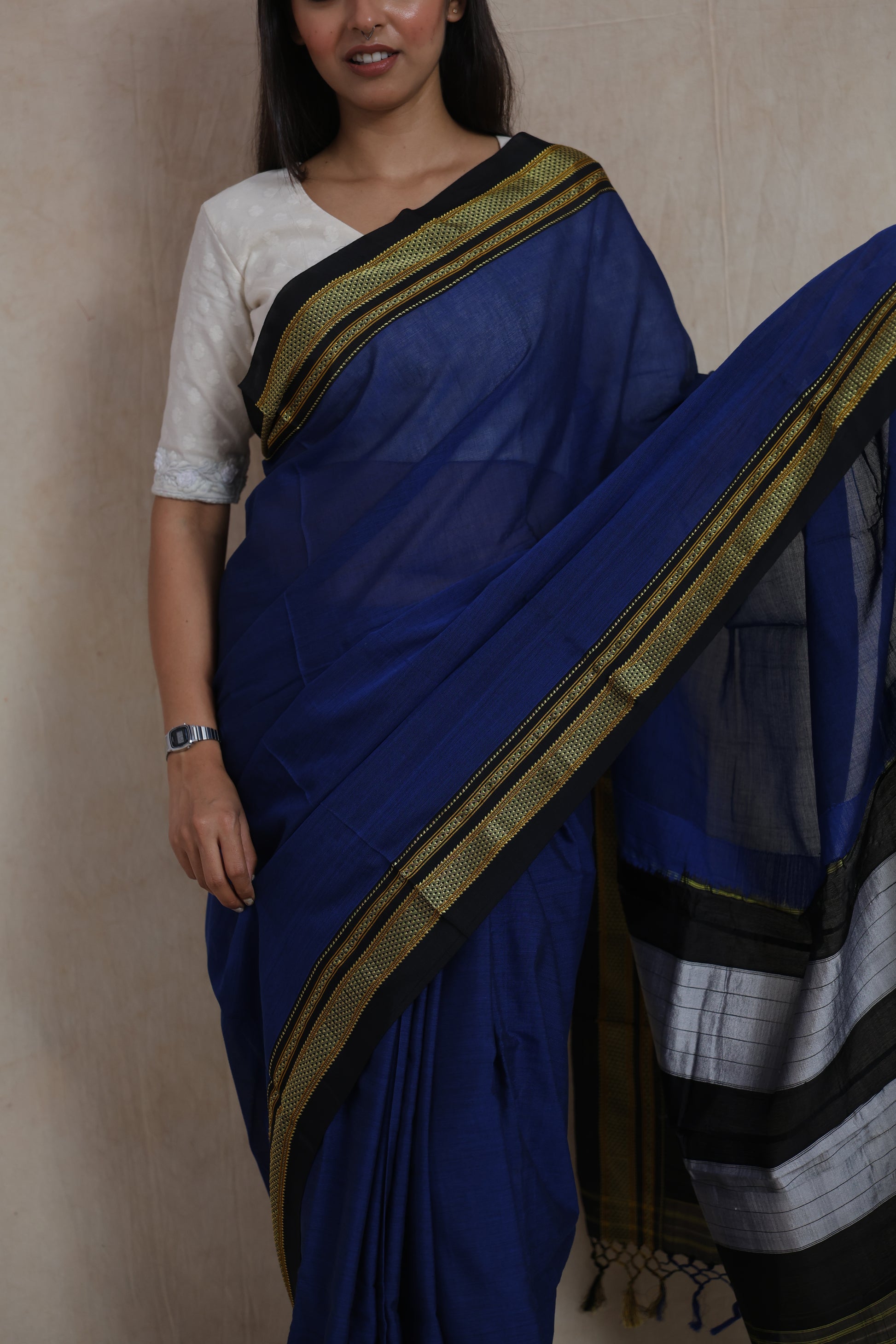 Detailed view of woven border and elegant drape of royal blue Ilkal handloom cotton saree