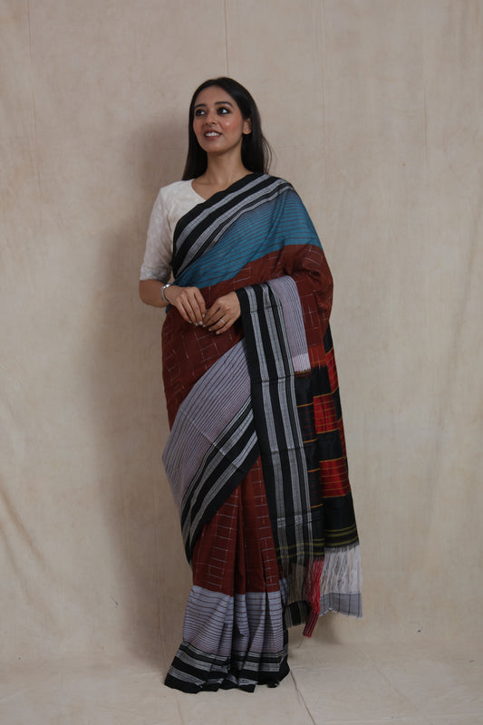 Elegant front drape of rust brown and teal Ilak cotton saree with woven stripes