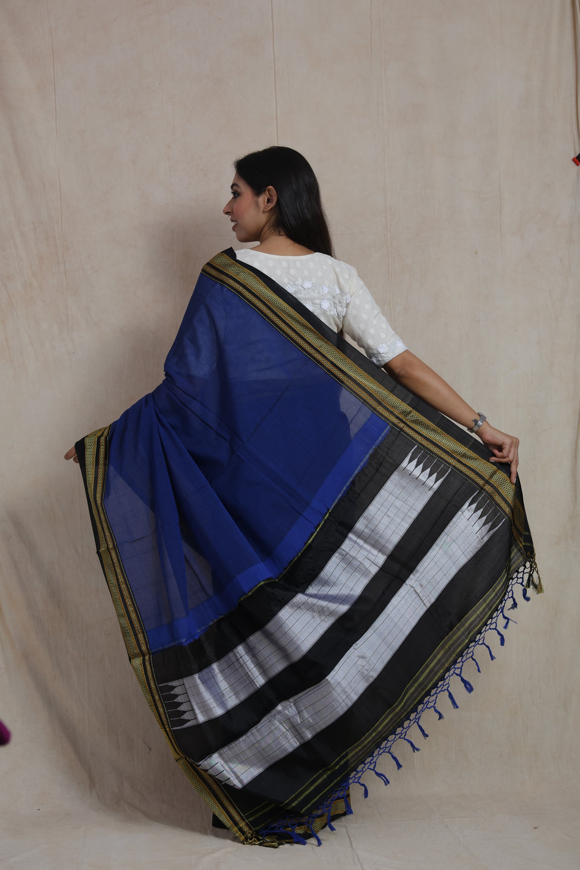 Back view displaying the distinctive traditional contrast pallu of a royal blue Ilkal saree