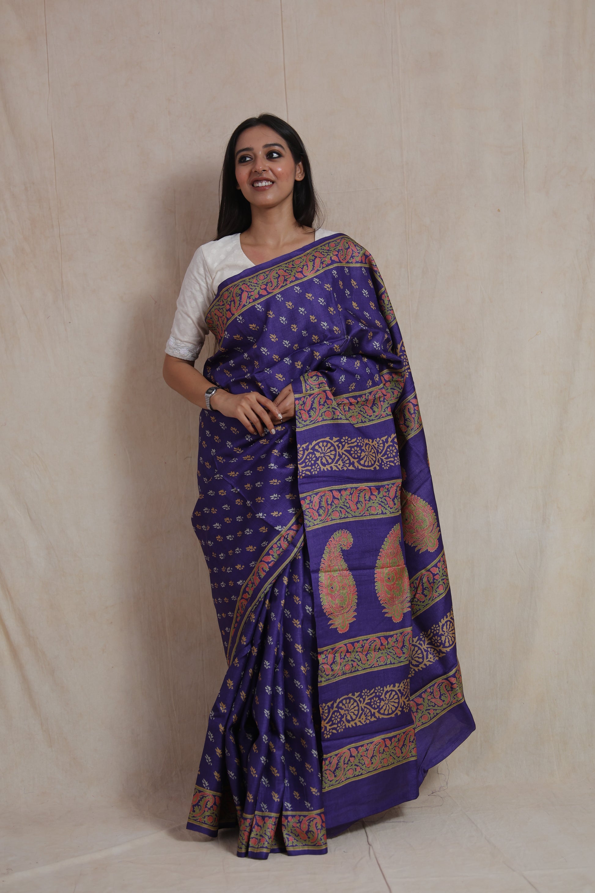 Front drape view of royal indigo Tussar print saree with floral buttas