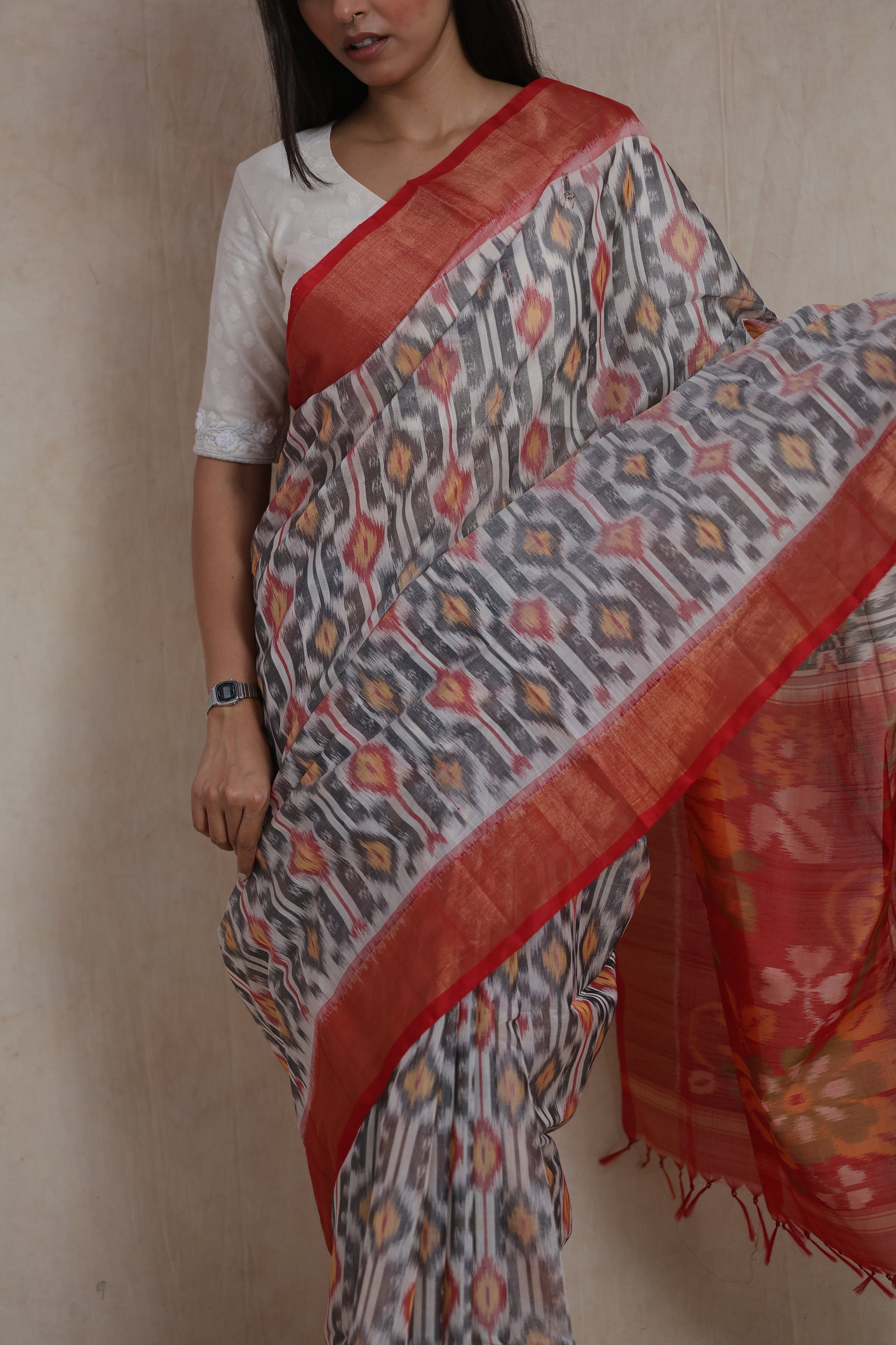 Close-up of traditional ikat motifs on ivory grey Pochampally SICO saree