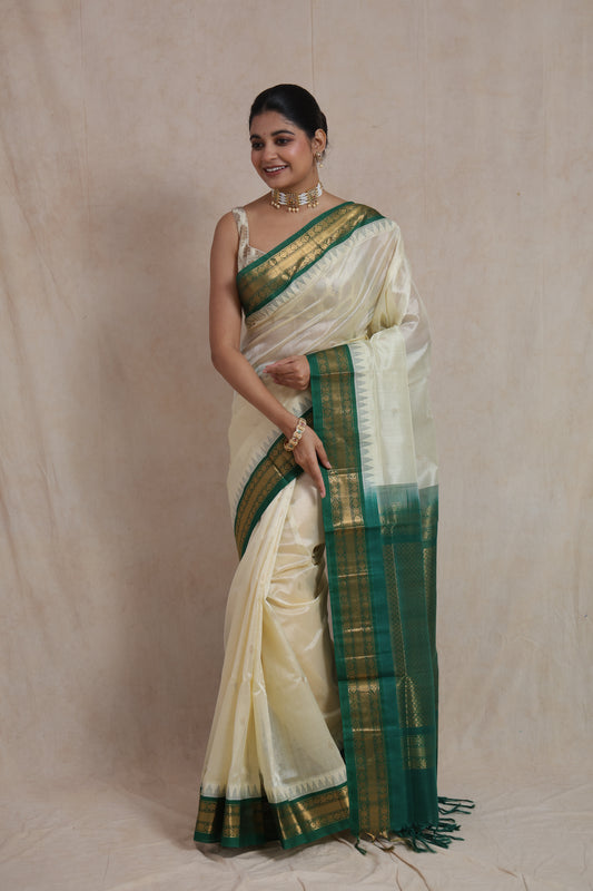 Ivory Kanchipuram silk cotton saree with emerald green zari border
