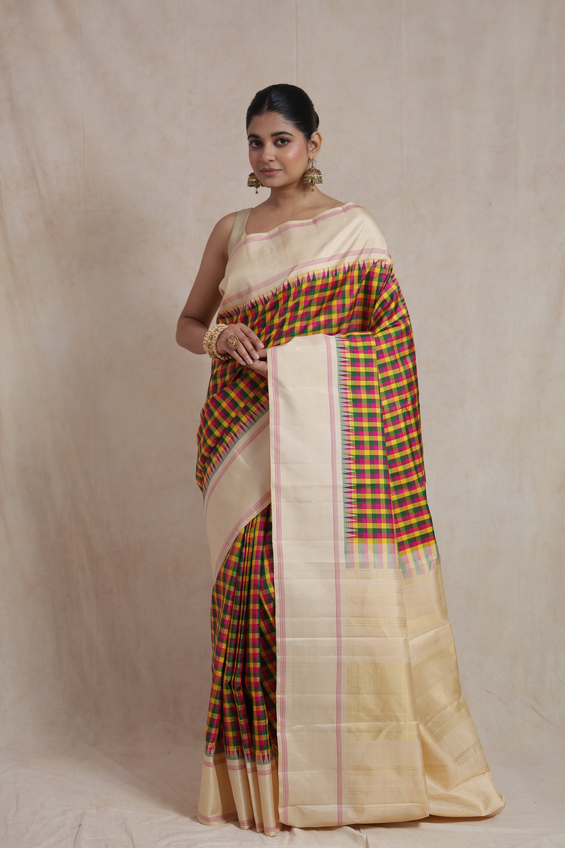 Ivory Kanjivaram pure silk saree featuring vibrant multicolor checked weave and elegant contrast border