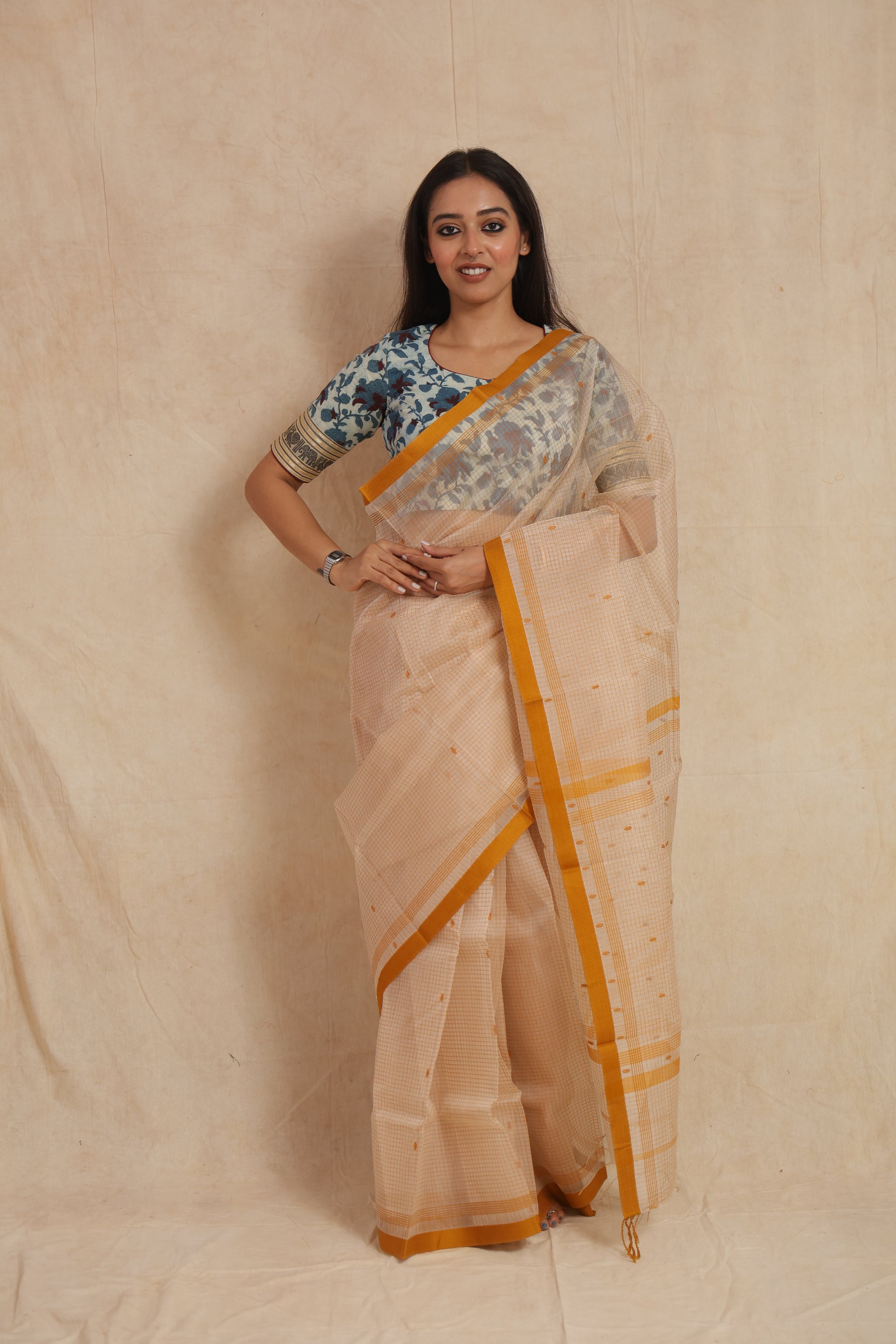 Front view of ivory Maheshwari cotton saree with mustard yellow border
