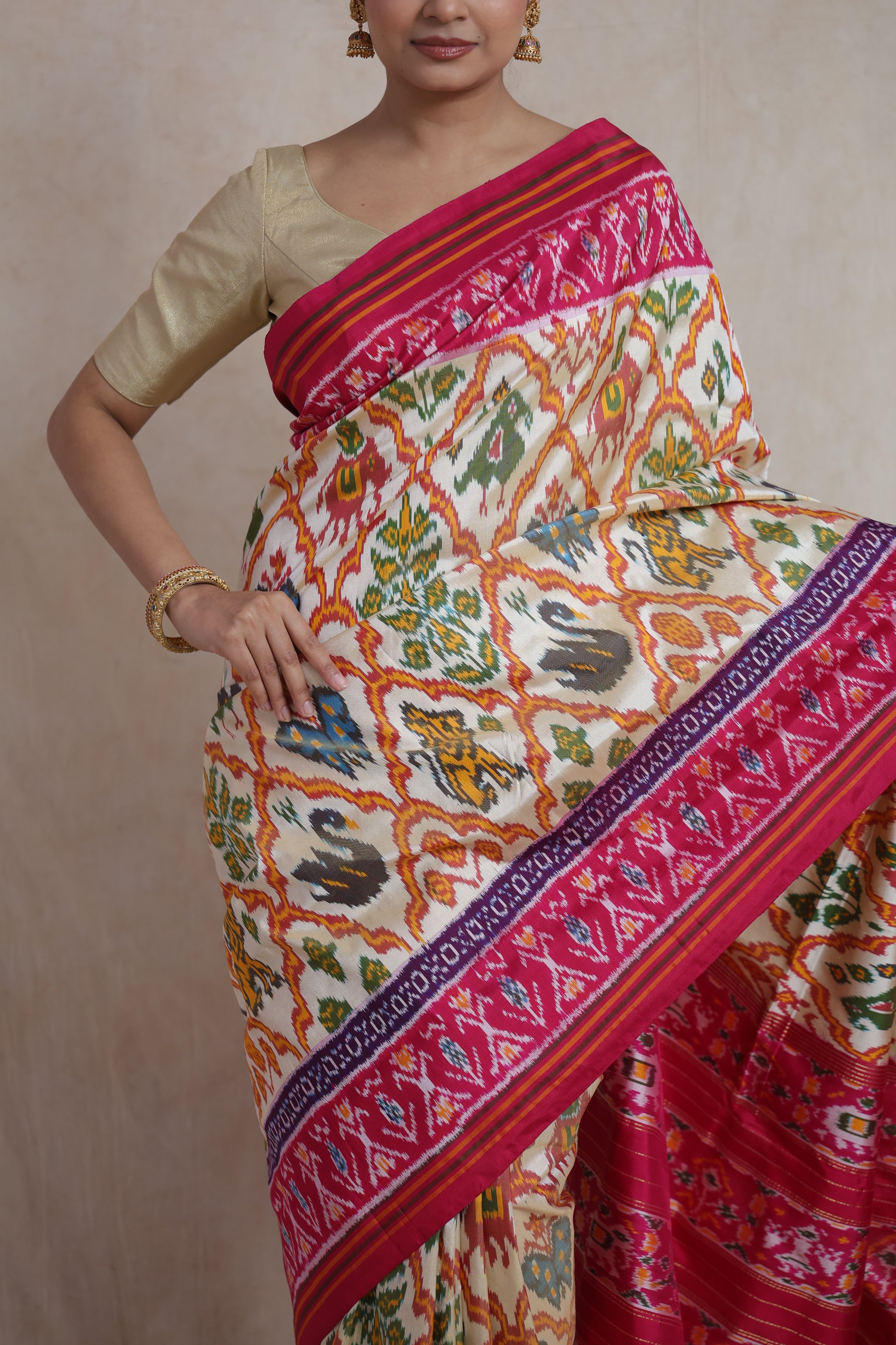 Front drape view of ivory Pochampally silk saree with multicolor ikat motifs