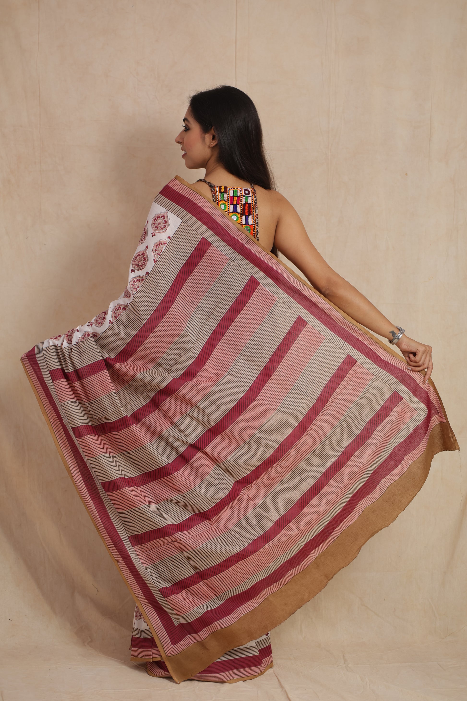 Back pallu view of ivory white Sanghnaree cotton saree with striped design