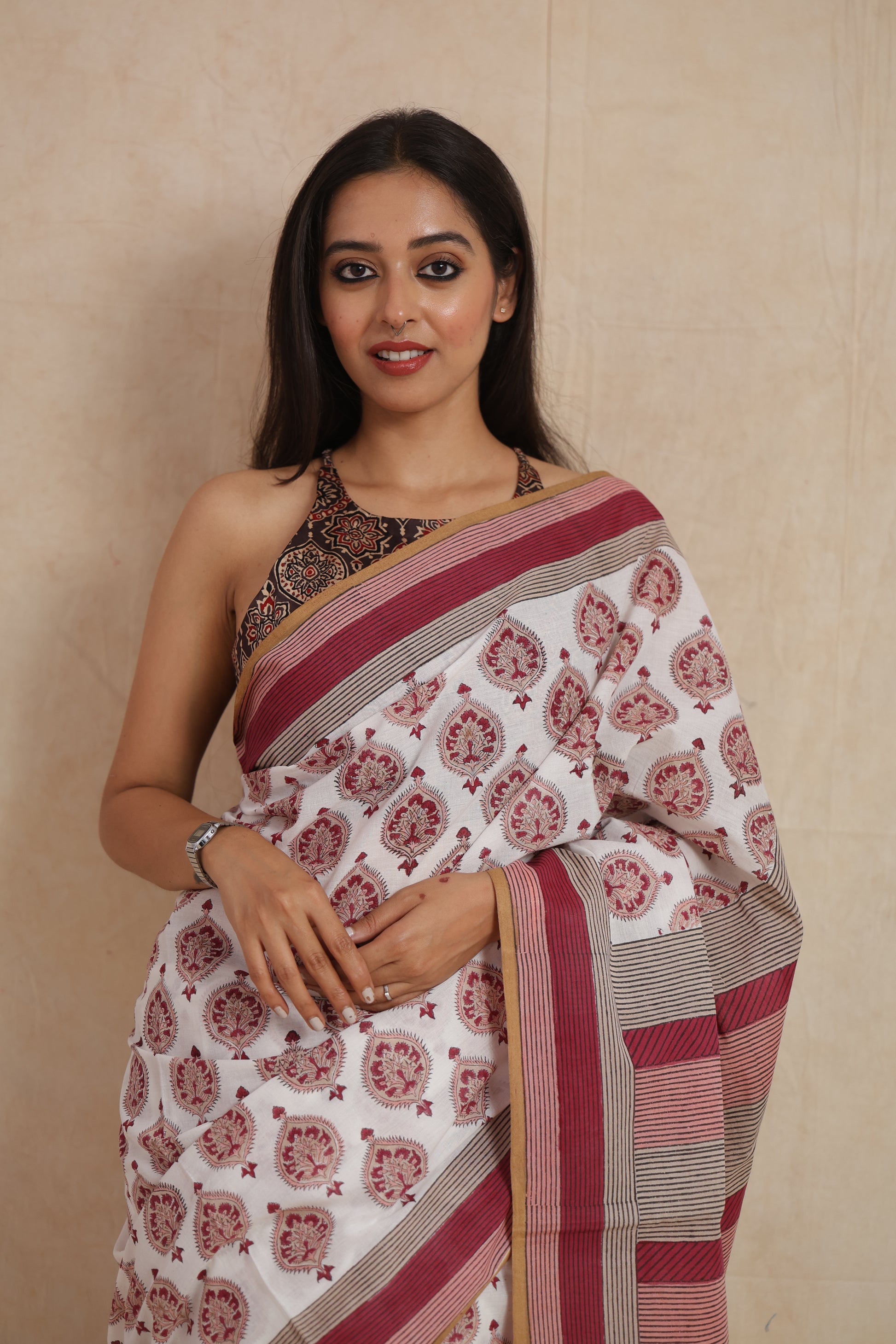 Portrait styling of ivory white Sanghnaree cotton saree with striped border