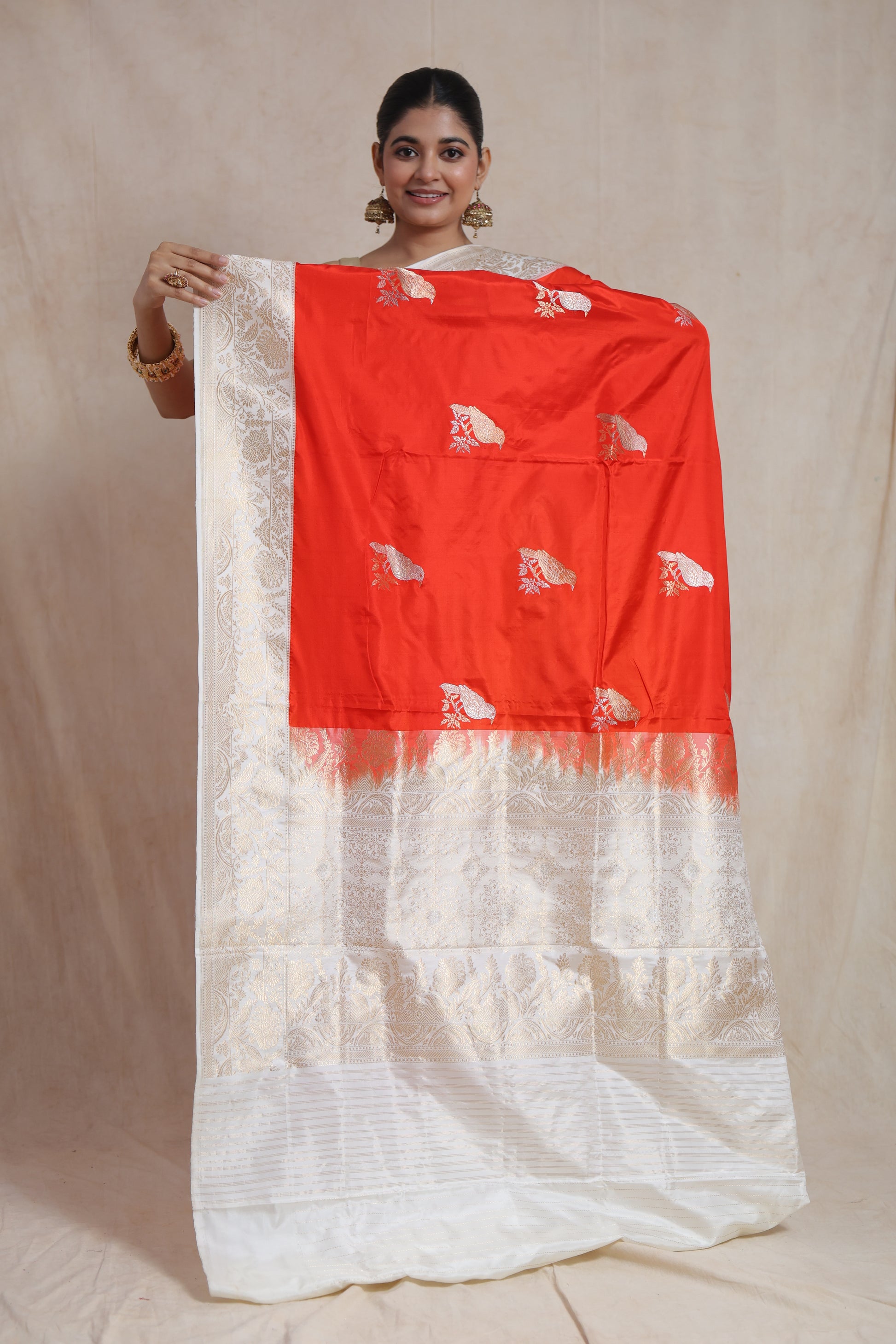 Intricate ivory zari floral border on luxurious Banarsee silk saree