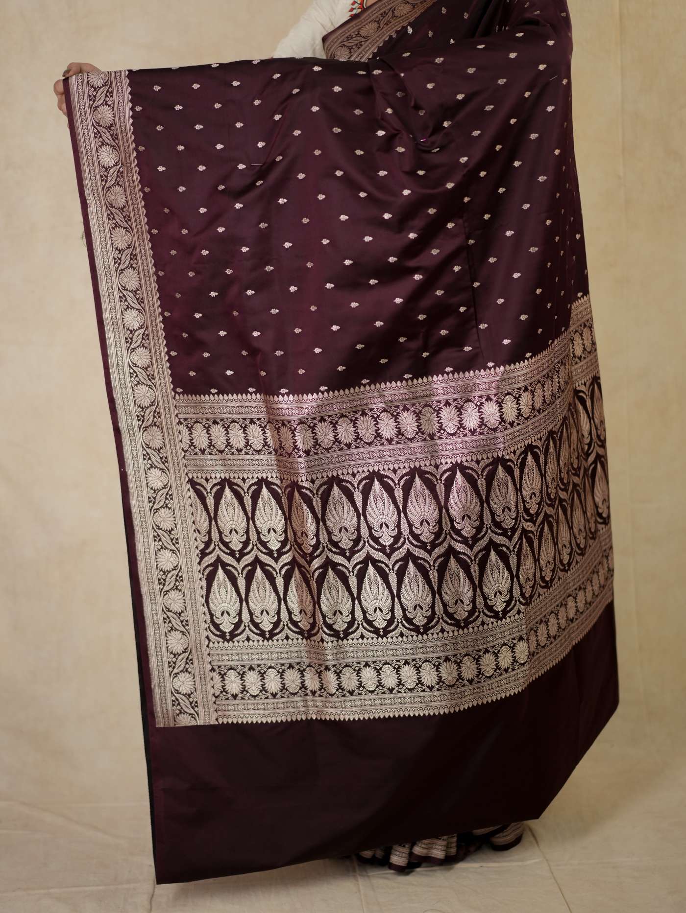 Dark brown Benarasi semi-silk saree with intricate gold zari work and matching blouse piece, traditional Indian attire by Joyee Kolkata.