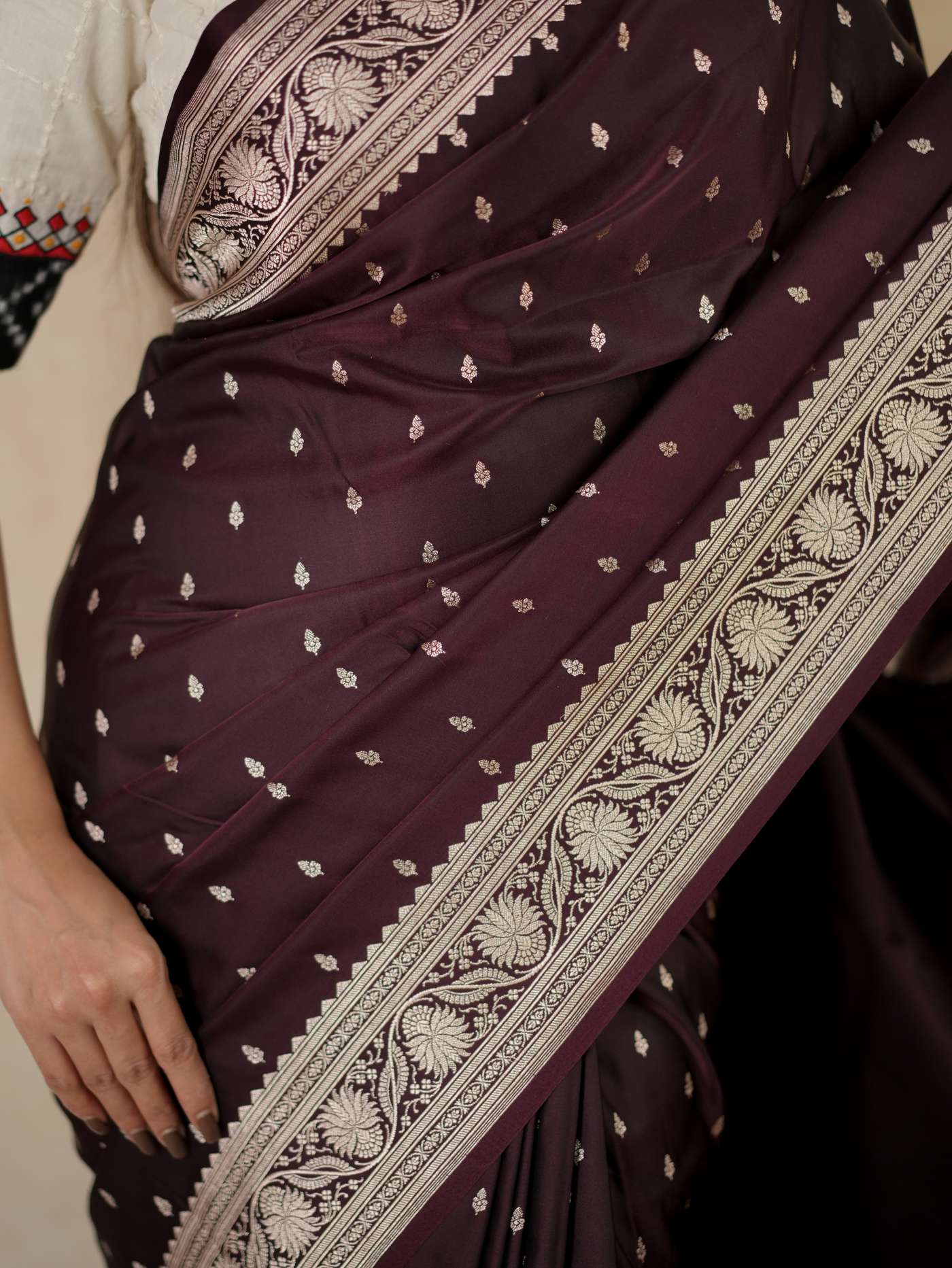 Dark brown Benarasi semi silk saree with intricate patterns and a matching 1-meter blouse piece, by Joyee Kolkata.
