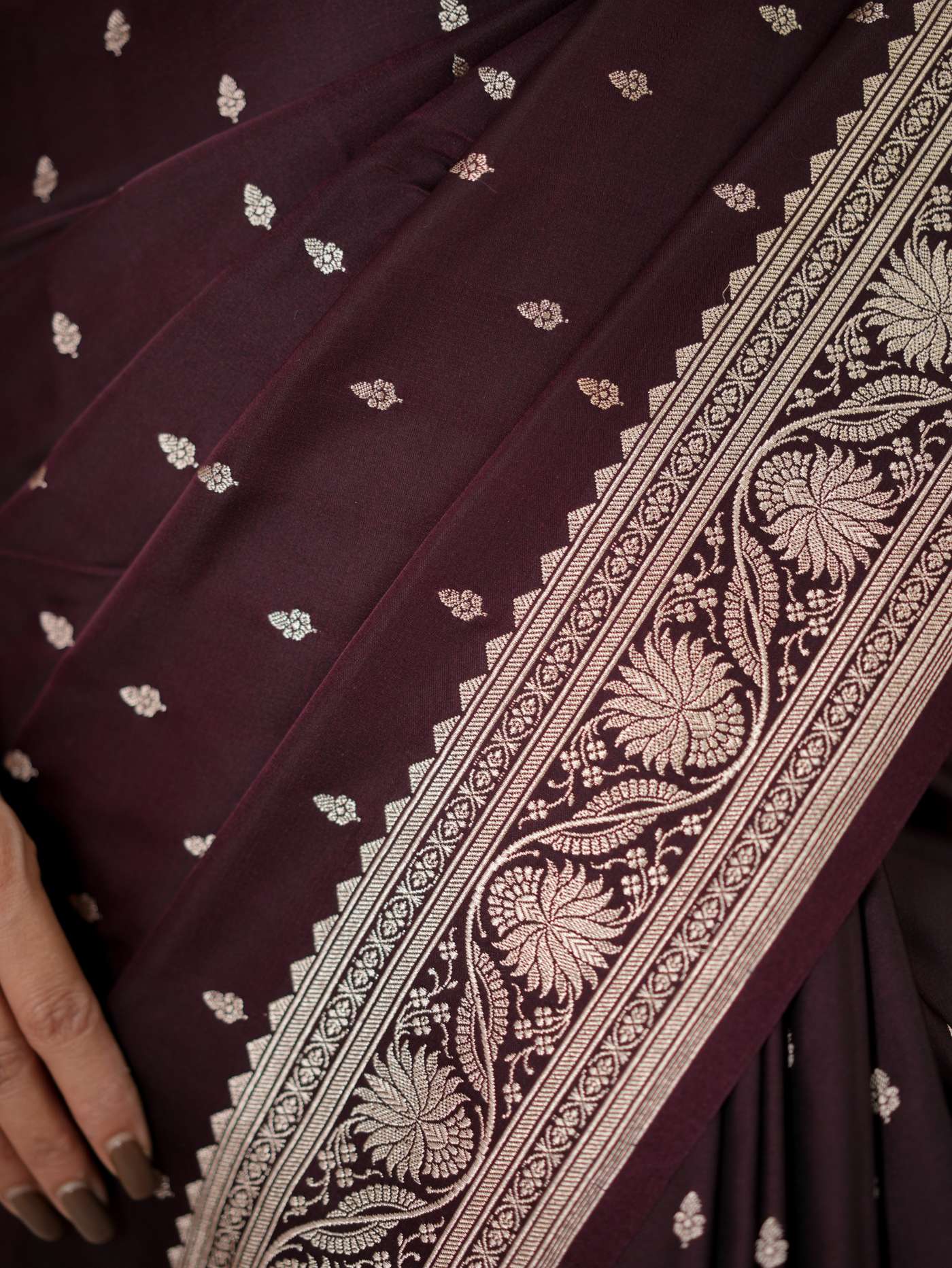 Dark brown Benarasi semi silk saree with intricate woven patterns and matching blouse piece from Joyee Kolkata.