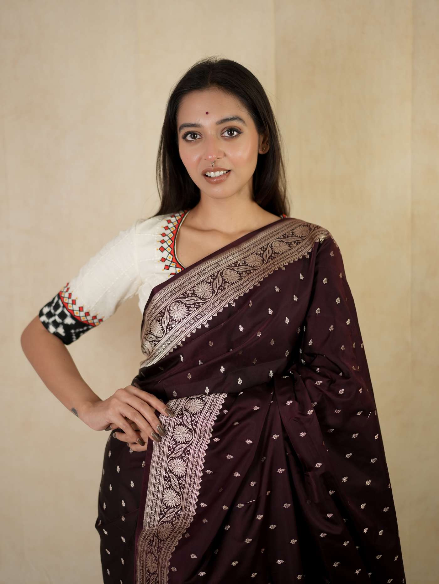 Dark brown Benarasi semi silk saree with intricate gold zari work and matching blouse piece, traditional Indian attire by Joyee Kolkata.