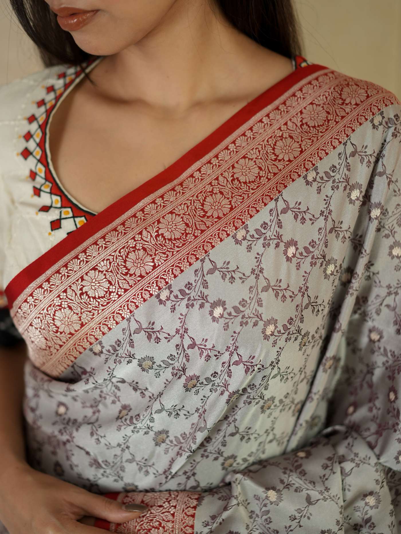 Grey semi-benaras silk saree with intricate patterns and matching blouse piece from Joyee Kolkata, elegant traditional Indian attire.