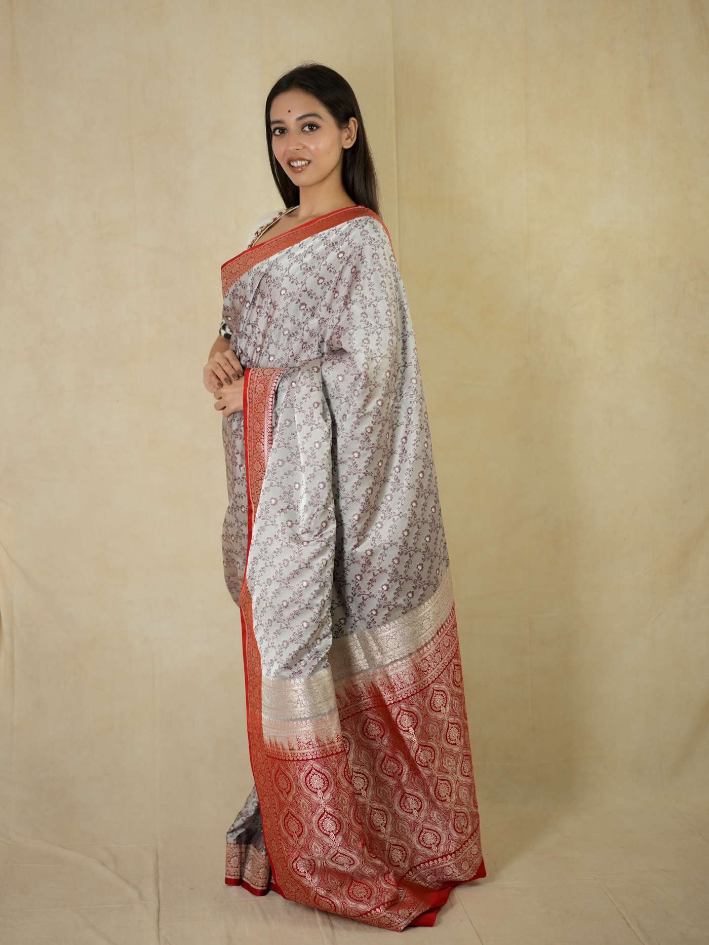Grey semi Benarasi silk saree with intricate designs and matching blouse piece from Joyee Kolkata, perfect for special occasions.
