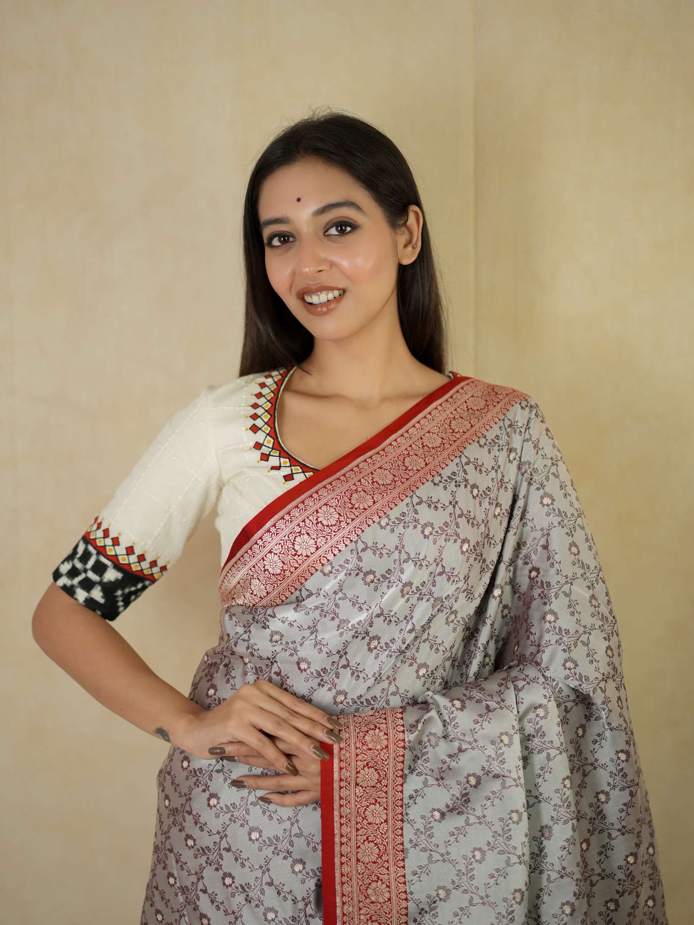 Grey semi Benarasi silk saree with intricate patterns and a matching 1 meter blouse piece from Joyee Kolkata.