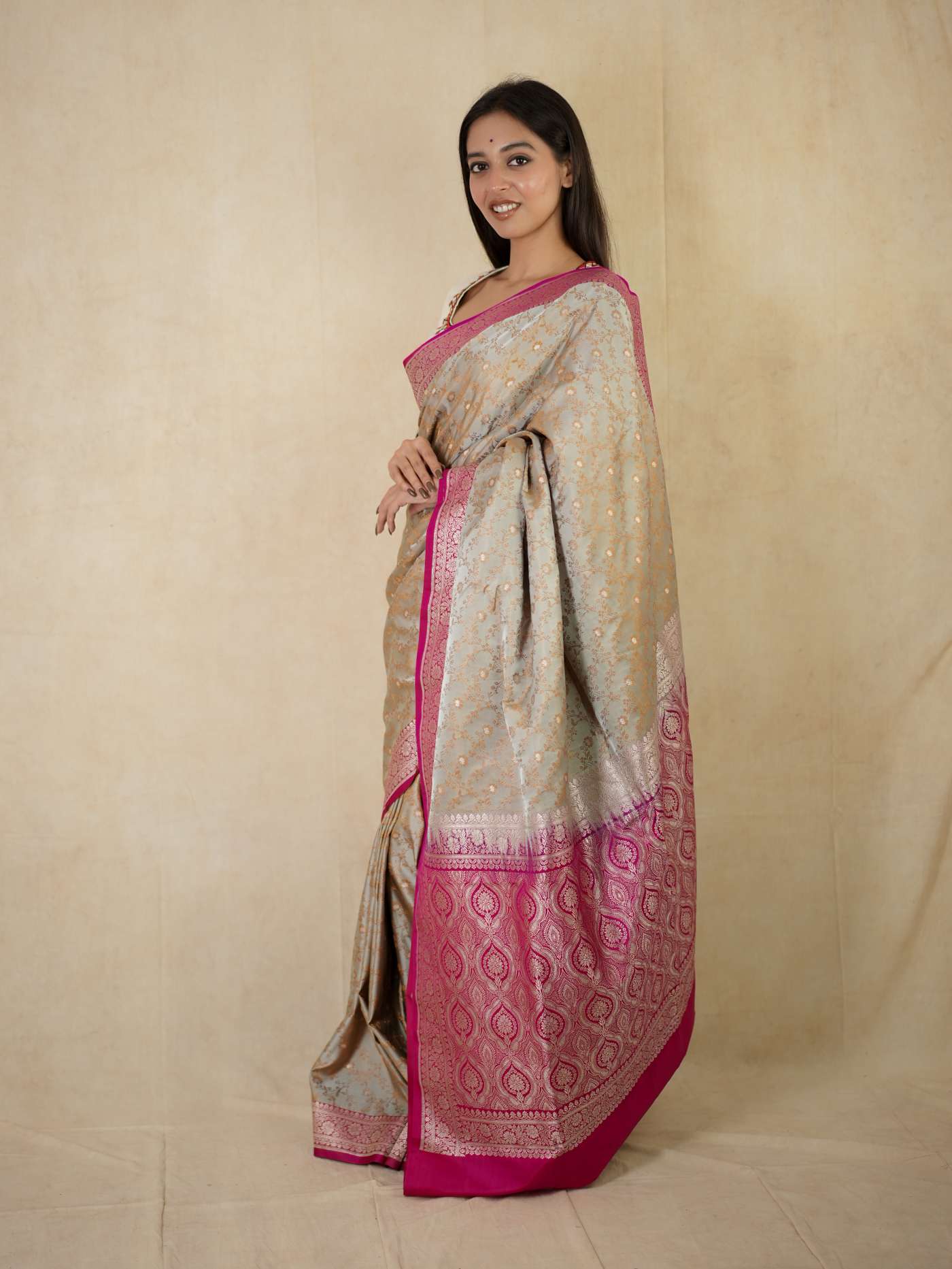 Grey semi Benarasi silk saree with intricate designs and matching blouse piece from Joyee Kolkata.