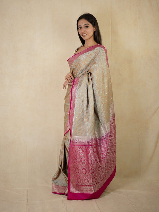 Grey semi Benarasi silk saree with intricate designs and matching blouse piece from Joyee Kolkata.
