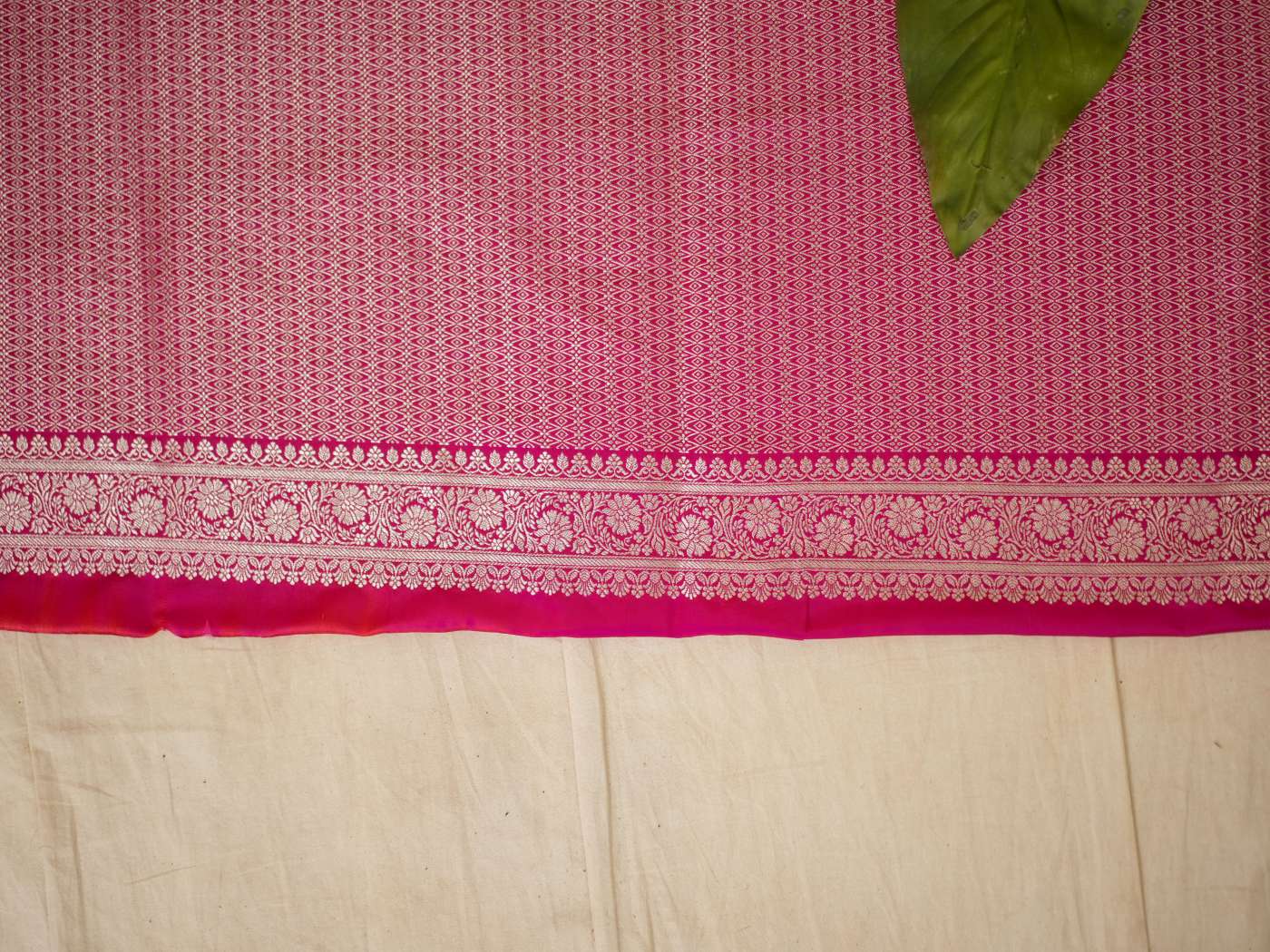 Grey semi-Benarasi silk saree with intricate design and matching blouse piece, crafted by Joyee Kolkata.