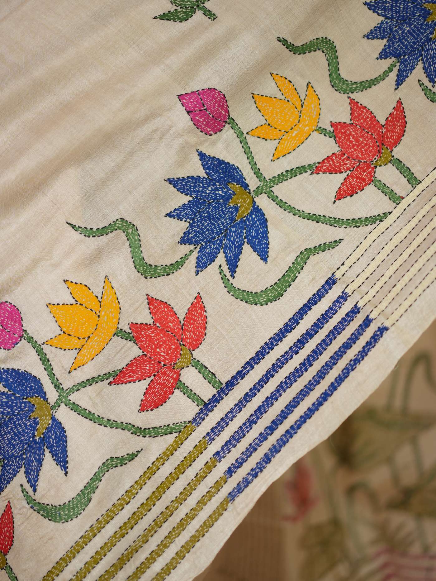 Handwoven off-white Kantha Tussar silk saree with intricate border and matching 98 cm blouse piece, from Joyee Kolkata.