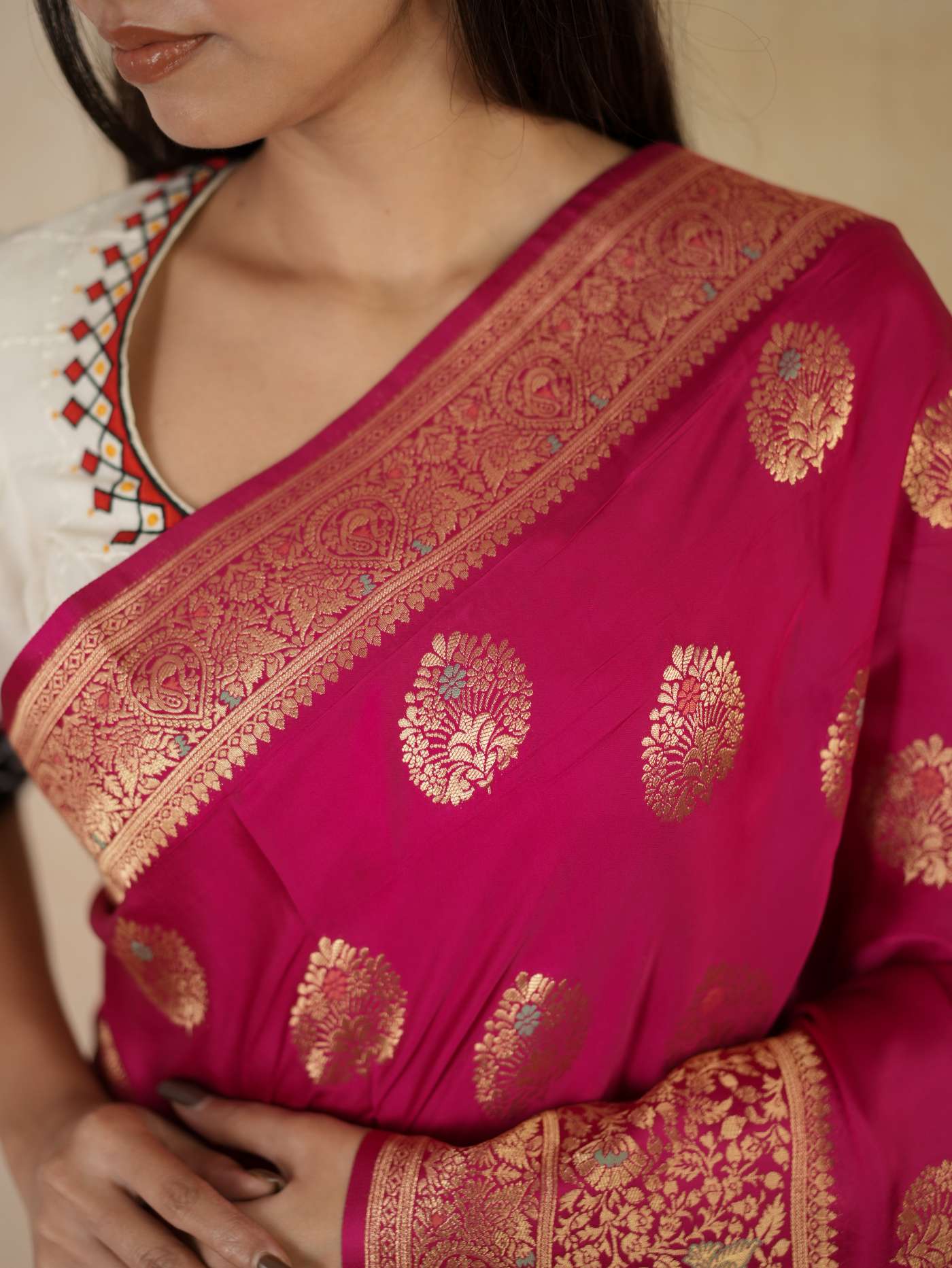 Magenta color Benarasi semi silk saree with intricate gold zari work and matching blouse piece, by Joyee Kolkata.