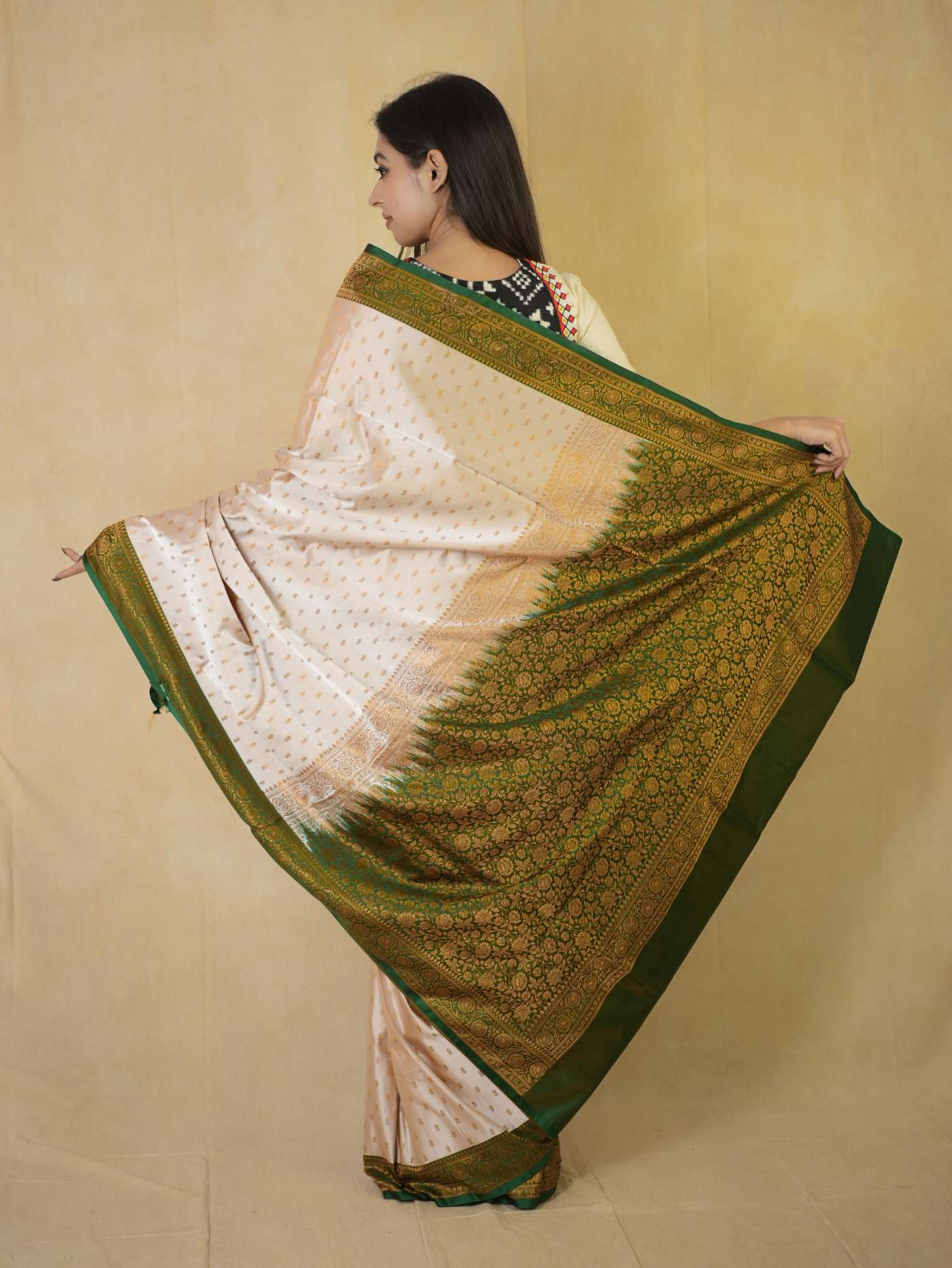 Cream semi Benarasi silk saree with intricate designs from Joyee Kolkata, paired with an 88 cm blouse piece.