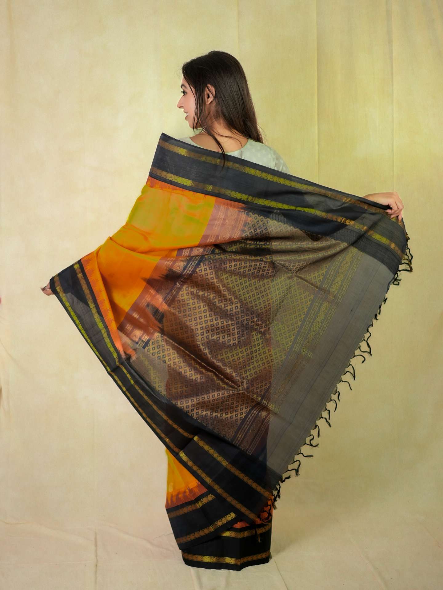 Orange Kanchipuram silk saree by Joyee Kolkata with matching 86 cm blouse piece, featuring traditional woven patterns.