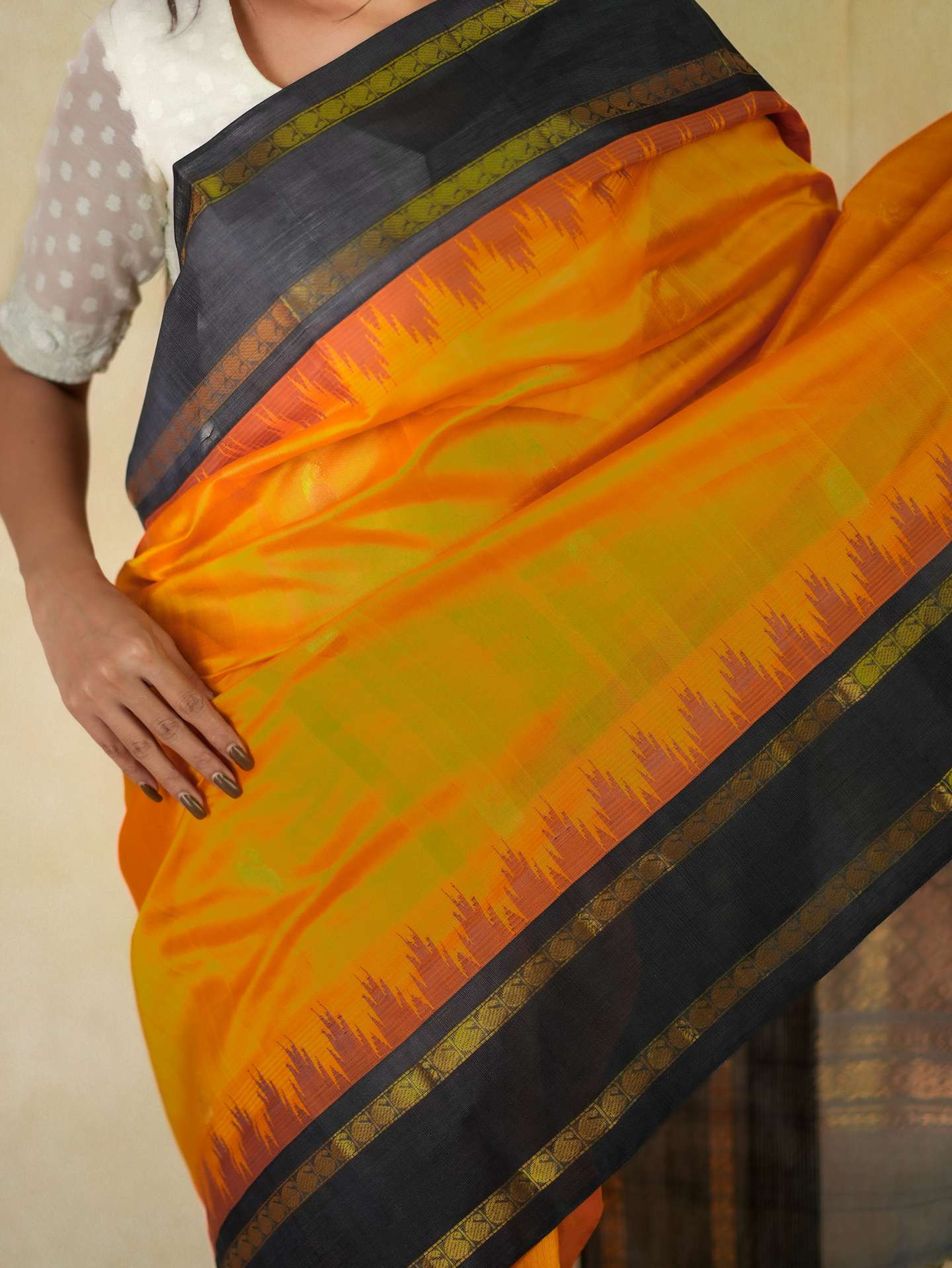 Orange Kanchipuram silk saree with cotton borders and 86 cm blouse piece, featuring intricate traditional weaving from Joyee Kolkata.