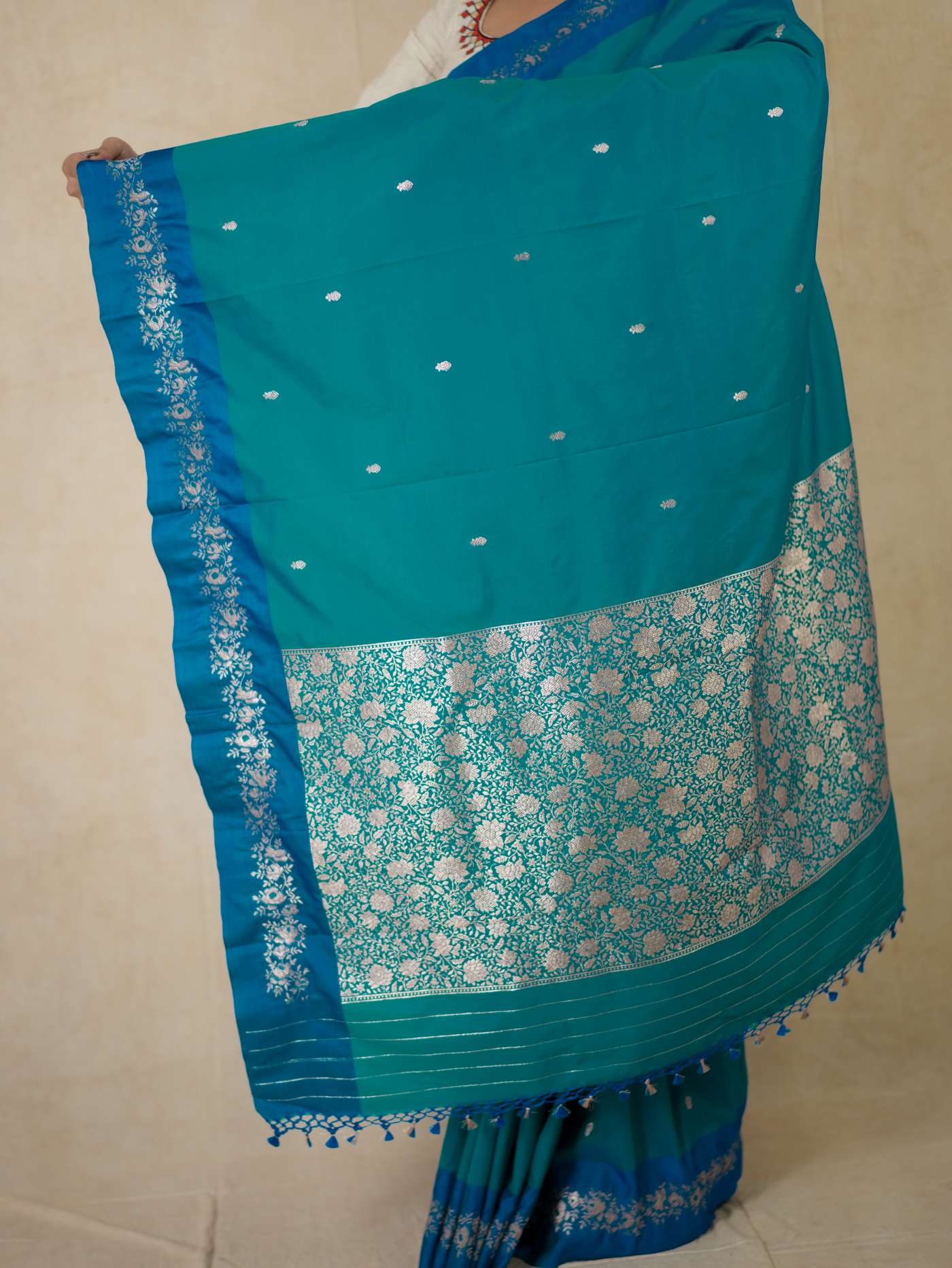 Turquoise blue semi silk saree with intricate design and matching blouse piece from Joyee Kolkata, traditional Indian attire.