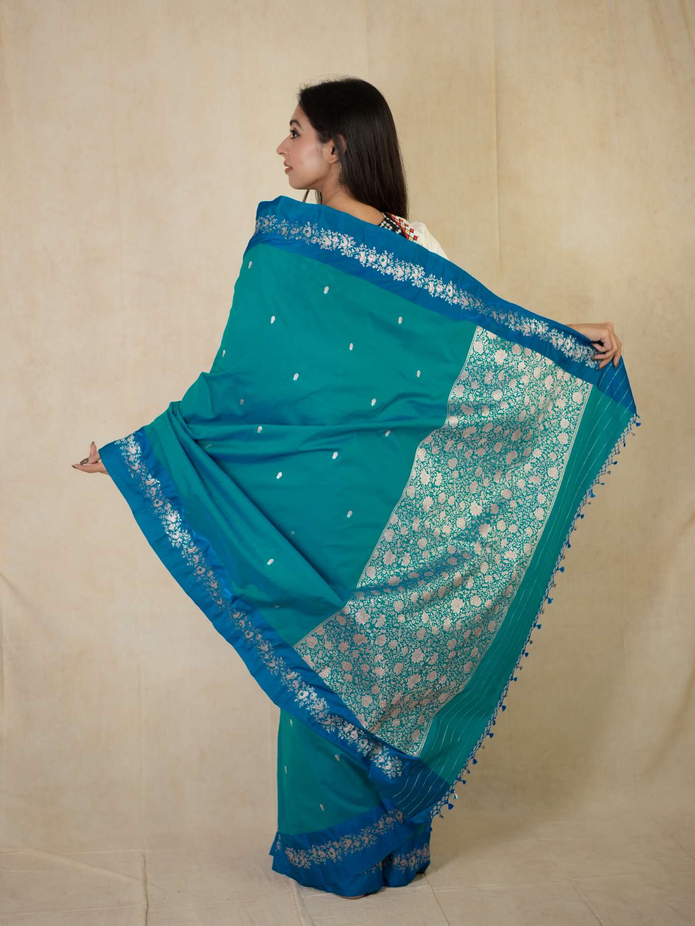 Turquoise blue Benarasi semi-silk saree with intricate gold work and matching blouse piece, from Joyee Kolkata.