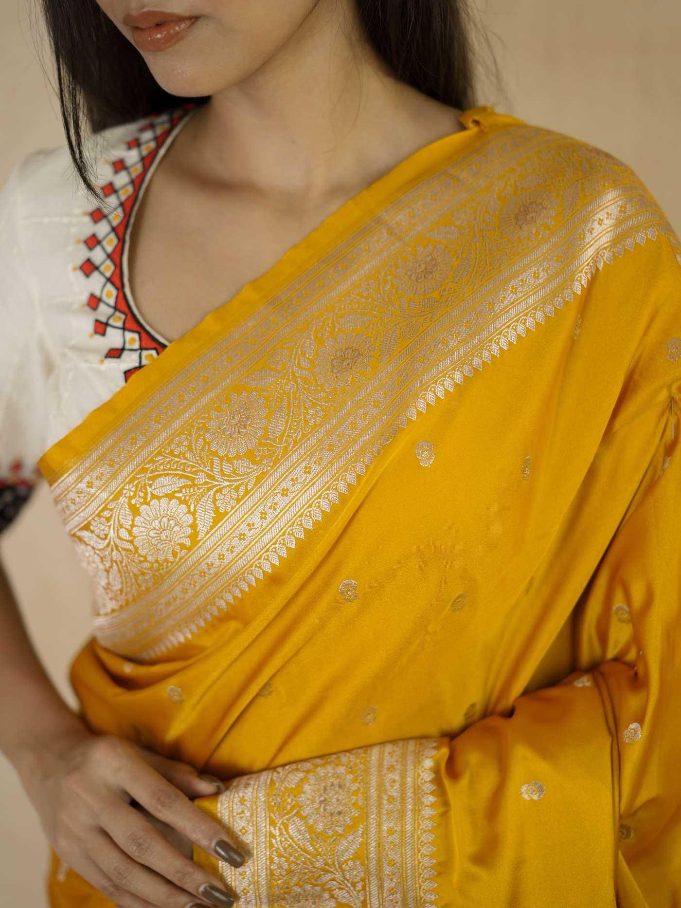 Yellow semi Benarasi silk saree with intricate patterns and matching blouse piece by Joyee Kolkata.